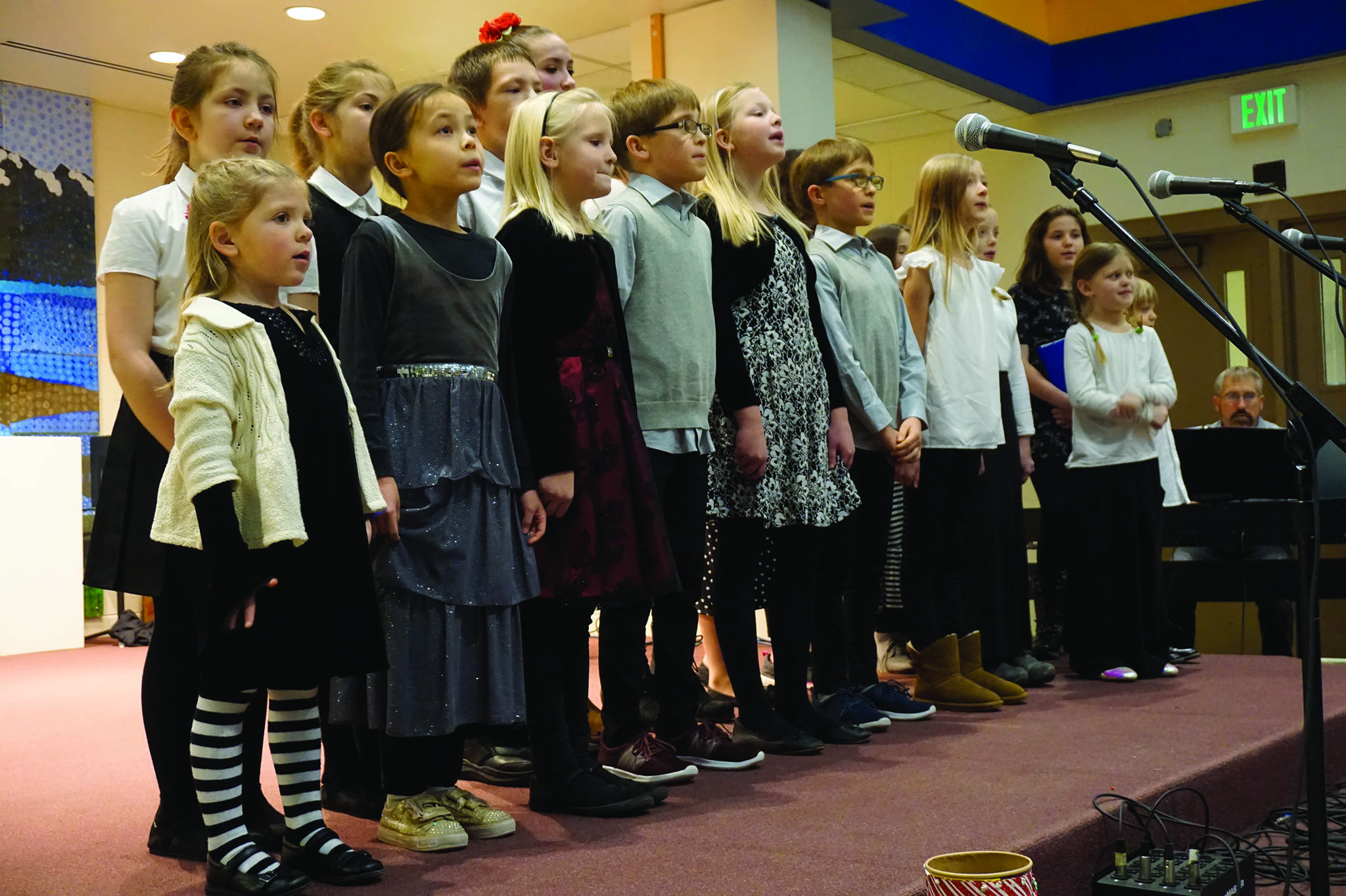 Children with the Harbor School of Music sing at the Homer Nutcracker Faire on Sunday, Dec. 8, 2019, at Homer High School in Homer, Alaska. (Photo by Michael Armstrong/Homer News)