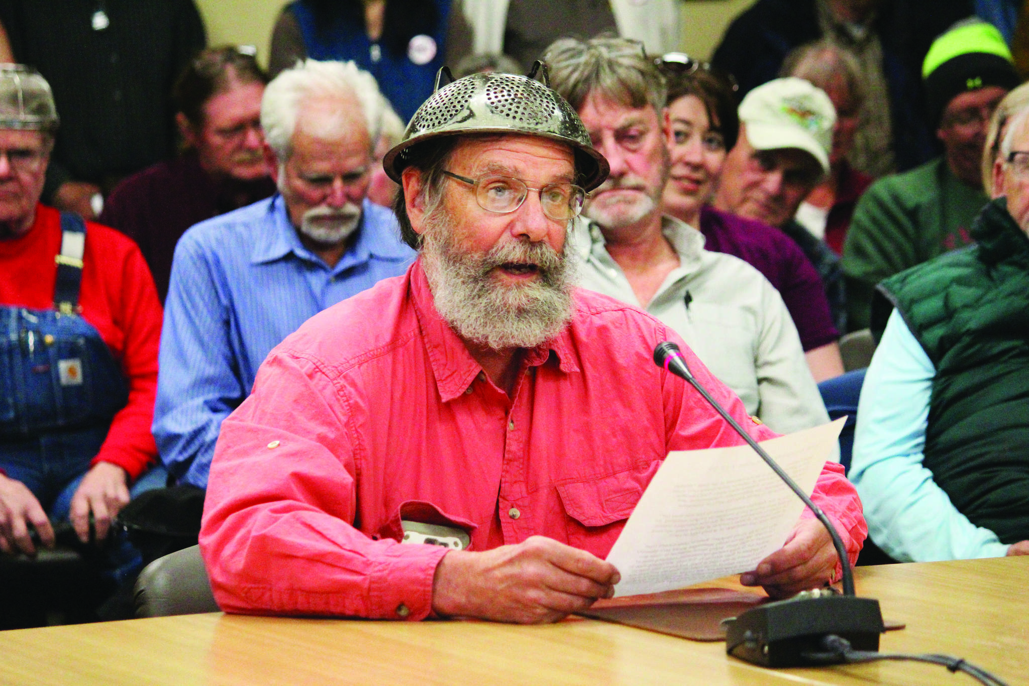 Frtiz Creek area resident Barrett Fletcher gives the invocation before a Tuesday, Sept. 17 2019 Kenai Peninsula Borough Assembly meeting as a representative of the Church of the Flying Spaghetti Monster at Homer City Hall in Homer, Alaska. (Photo by Megan Pacer/Homer News)