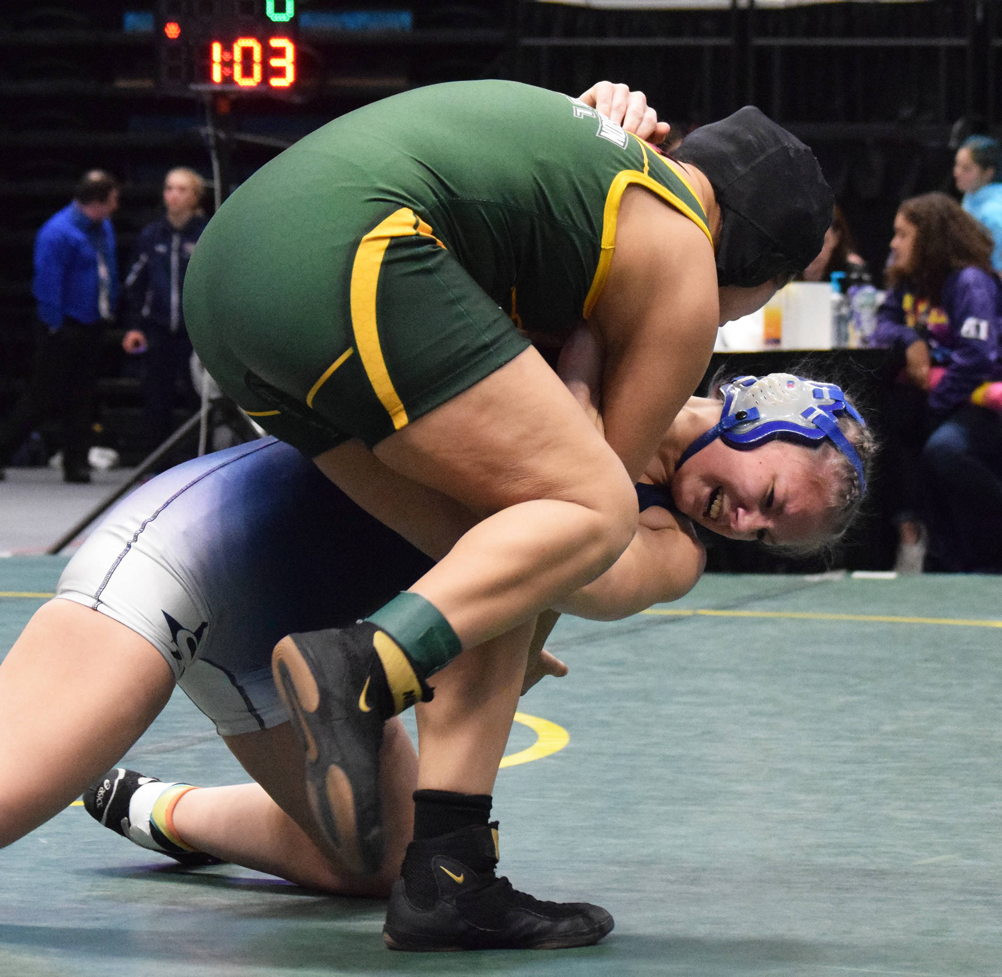 Soldotna’s Amanda Wylie grapples with Alaina Pete of Brevig Mission in the girls 160-pound final Saturday, Dec. 21, 2019, at the ASAA State Wrestling Championships at the Alaska Airlines Center in Anchorage, Alaska. (Photo by Joey Klecka/Peninsula Clarion)