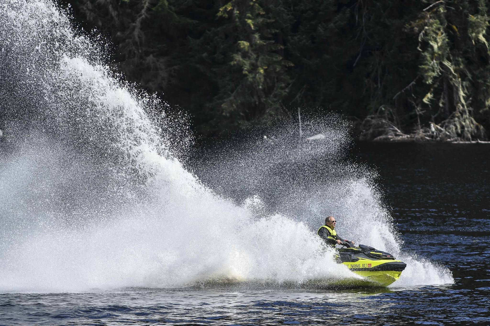 Terry Allen rides his jet ski at Auke Lake on Monday, Aug. 19, 2019. (Michael Penn | Juneau Empire)