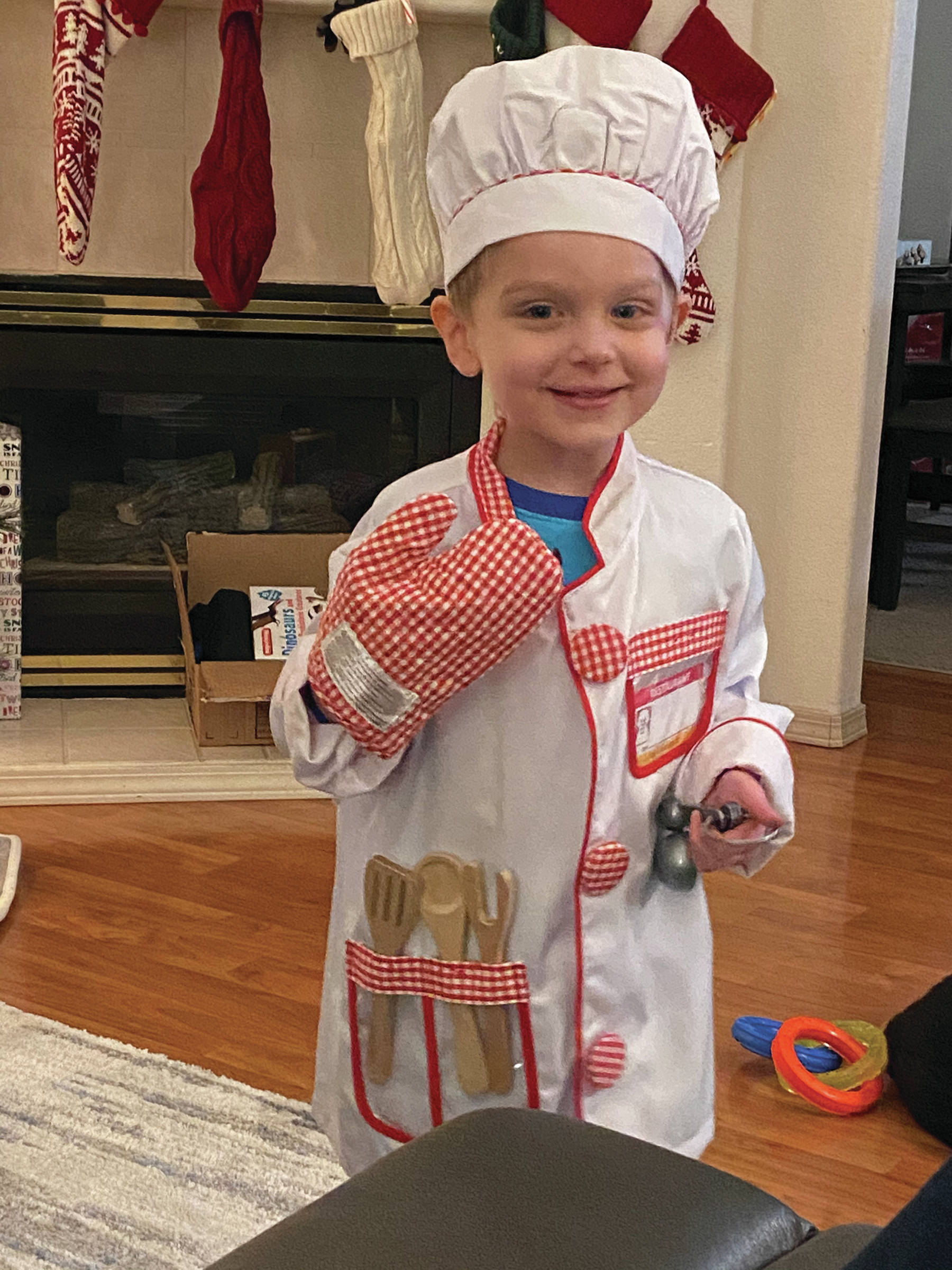 Teri Robl’s grandson, Kase, is ready to help his grandmother in the kitchen, as seen here on Dec. 25, 2019, at her Homer, Alaska, home. (Photo by Teri Robl)