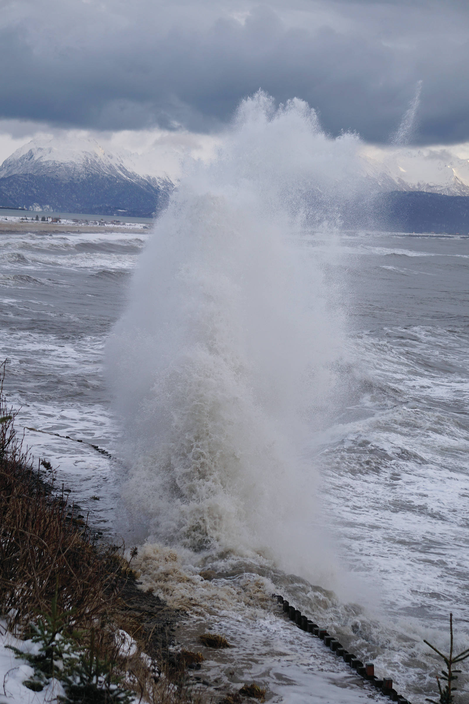 Waves crash against the Ocean Drive Loop seawall during a storm on the Homer Spit on Thursday, Dec. 26, 2019, in Homer, Alaska. The combination of a 20.7-foot high tide and swells out of the southwest hammered the north shore of Kachemak Bay. (Photo by Michael Armstrong/Homer News)