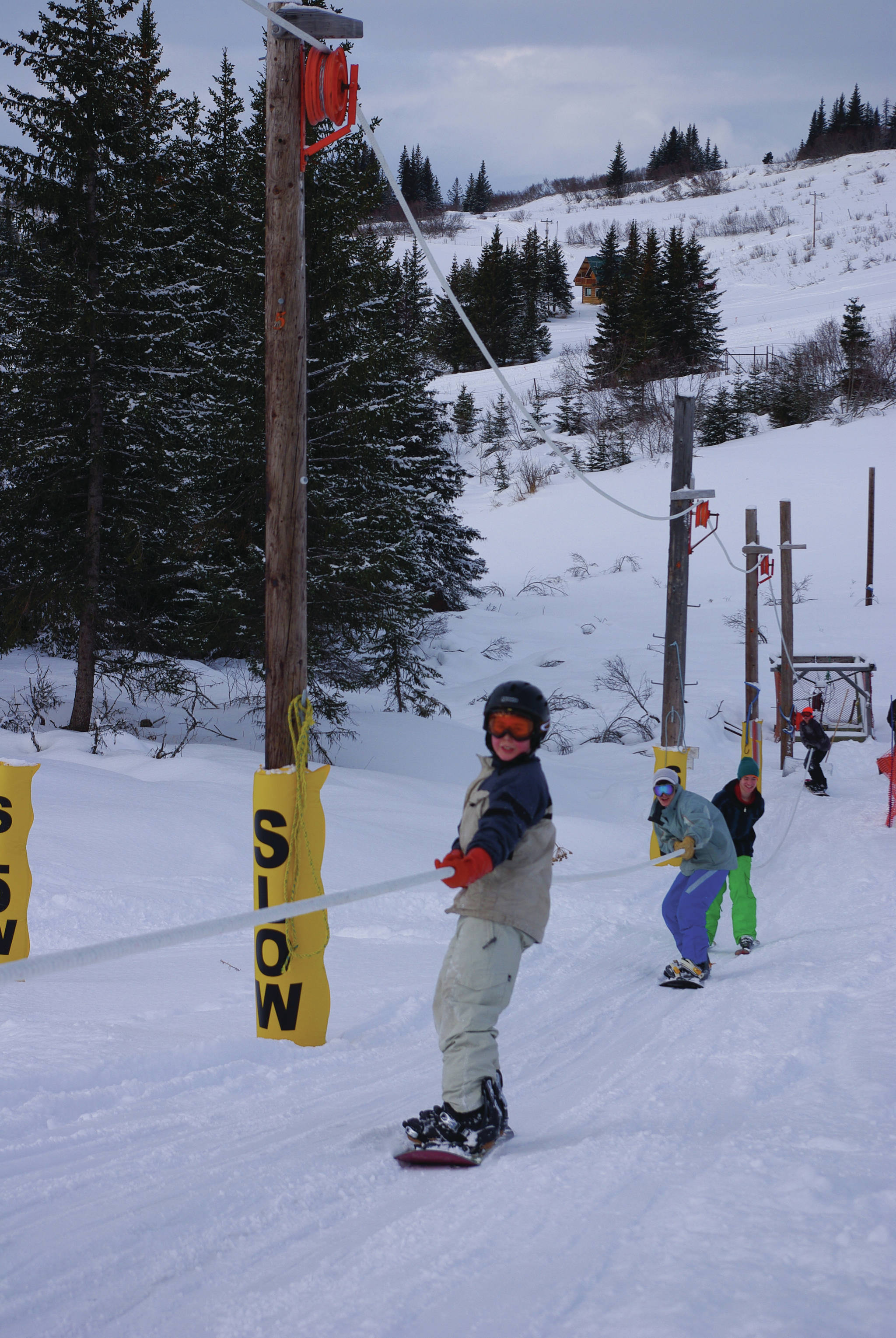Skiers get a lift up the hill at the Homer Rope Tow on Ohlson Mountain in this March 2014 photo in Homer, Alaska. Opening day for the Rope Tow is at 11 a.m. Sunday, Jan. 2. (Homer News file photo)