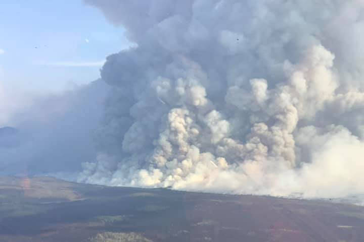 Photo courtesy Alaska Wildland Fire Information                                 The Swan Lake Fire can be seen from above on Monday, Aug. 26 on the Kenai Peninsula, Alaska. The fire forced HEA to de-energize the transmission line that runs to Anchorage for several months, which essentially isolated the Kenai Peninsula from the rest of the utility rail belt.