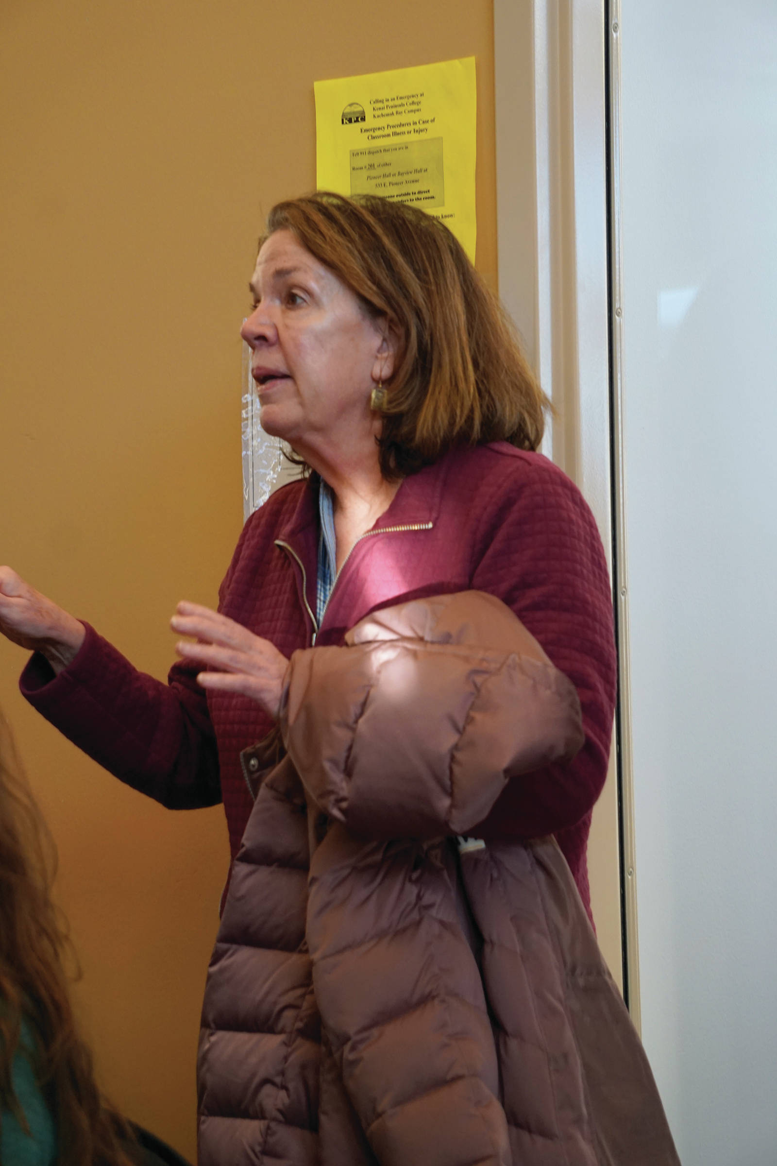 Patricia Cue asks Rep. Sarah Vance, R-Homer, a question at a town hall meeting last Saturday, Jan. 11, 2020, at the Kachemak Bay Campus in Homer, Alaska. (Photo by Michael Armstrong/Homer News)