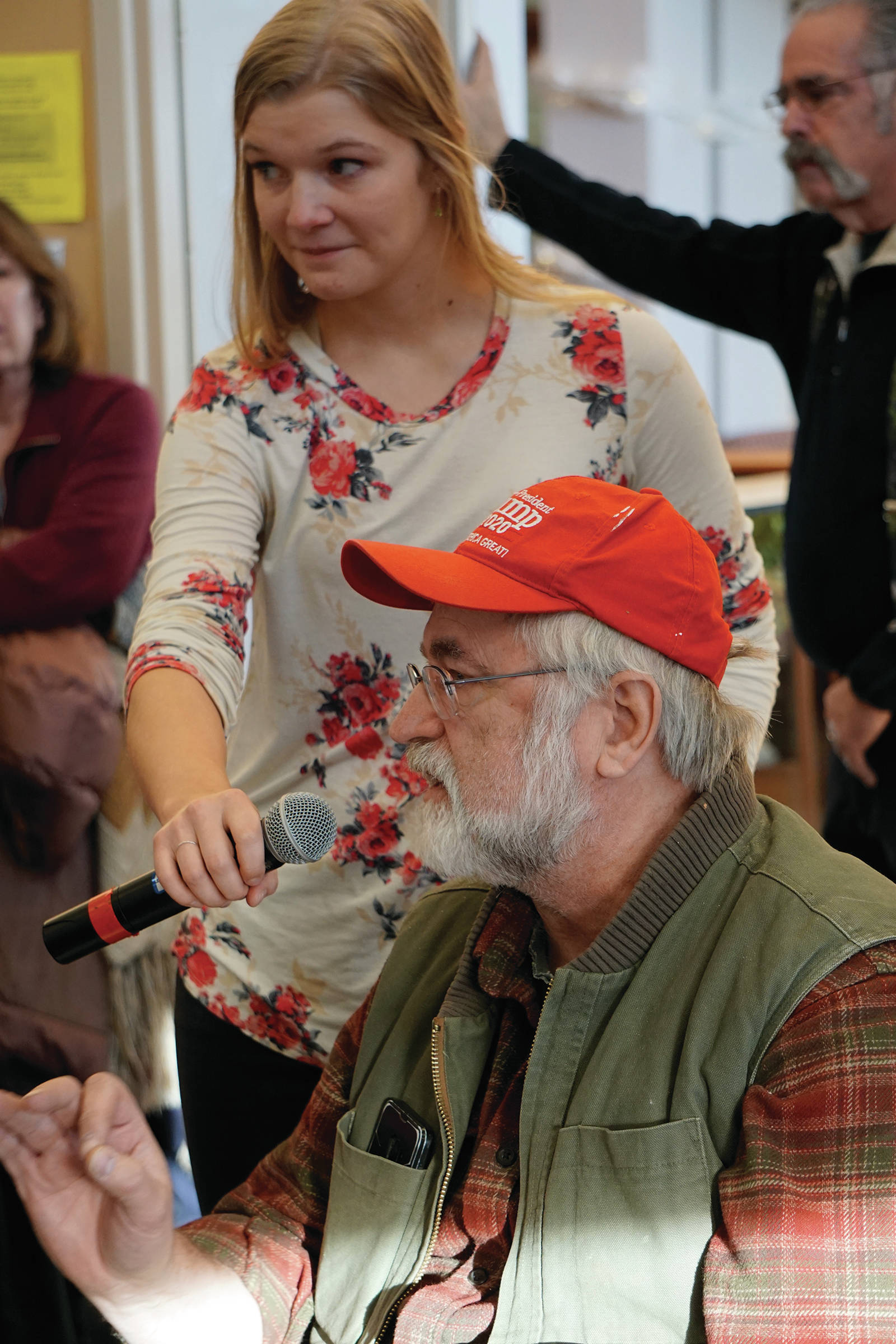 Randy Arndt asks Rep. Sarah Vance, R-Homer, a question at a town hall last Saturday, Jan. 11, 2020, at the Kachemak Bay Campus in Homer, Alaska. Legislative aide Lauren Simpson holds the microphone for Arndt. (Photo by Michael Armstrong/Homer News)