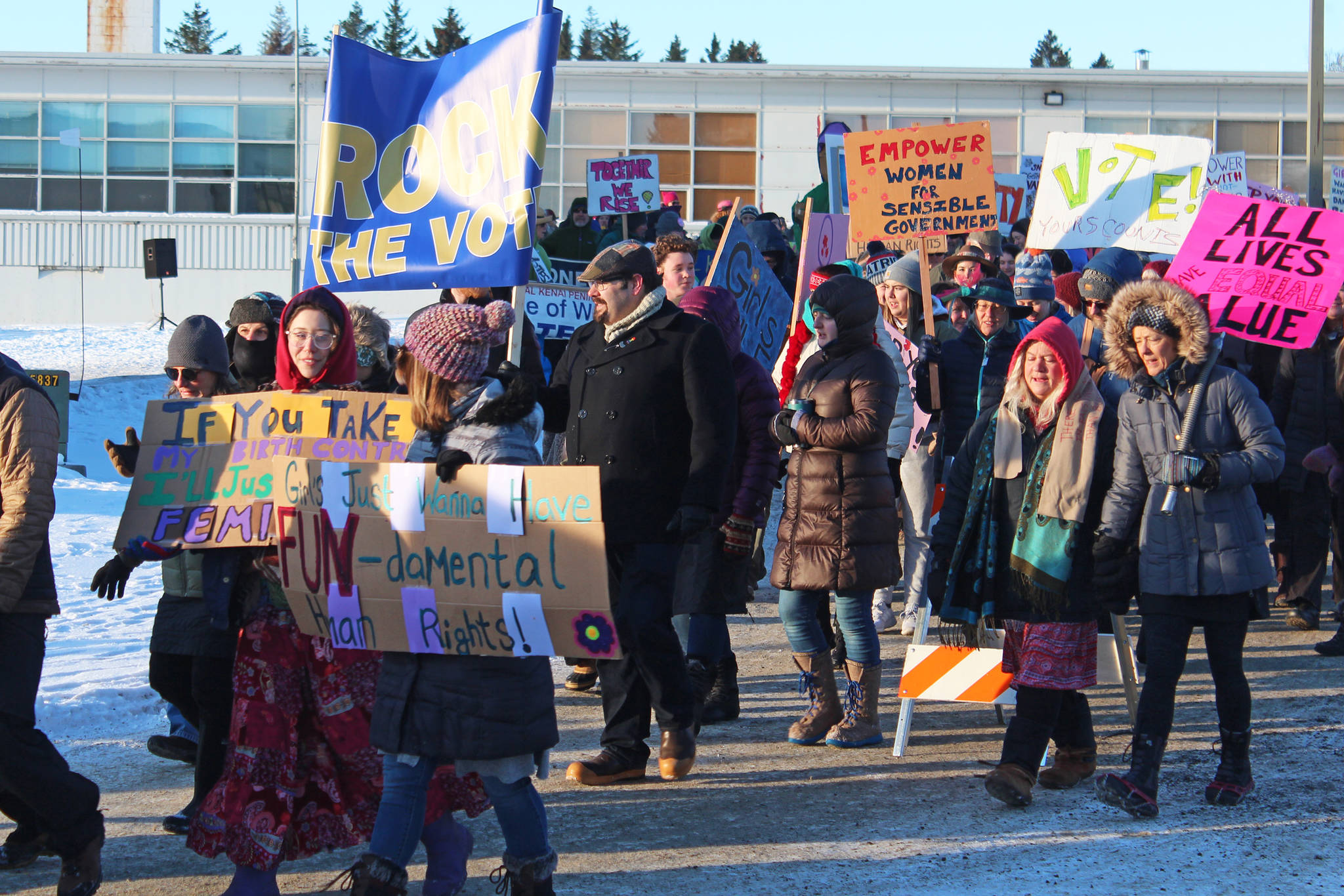 Community members march from the Homer Education and Recreation Complex to WFKL Park for the fourth Women’s March on Homer on Saturday, Jan. 18, 2020 in Homer, Alaska. About 300 people participated. (Photo by Megan Pacer/Homer News)