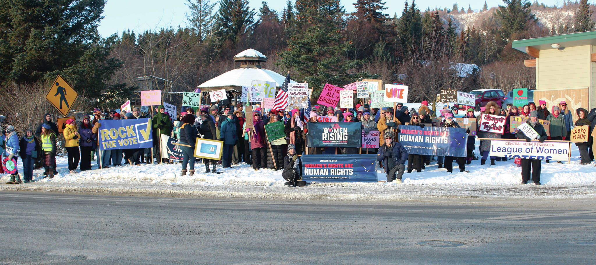 About 300 men, women and children gather at WKFL Park for a photo after completing this year’s Women’s March on Homer on Saturday, Jan. 18, 2020 in Homer, Alaska. Marchers started at the Homer Education and Recreation Complex and walked along Pioneer Avenue. (Photo by Megan Pacer/Homer News)