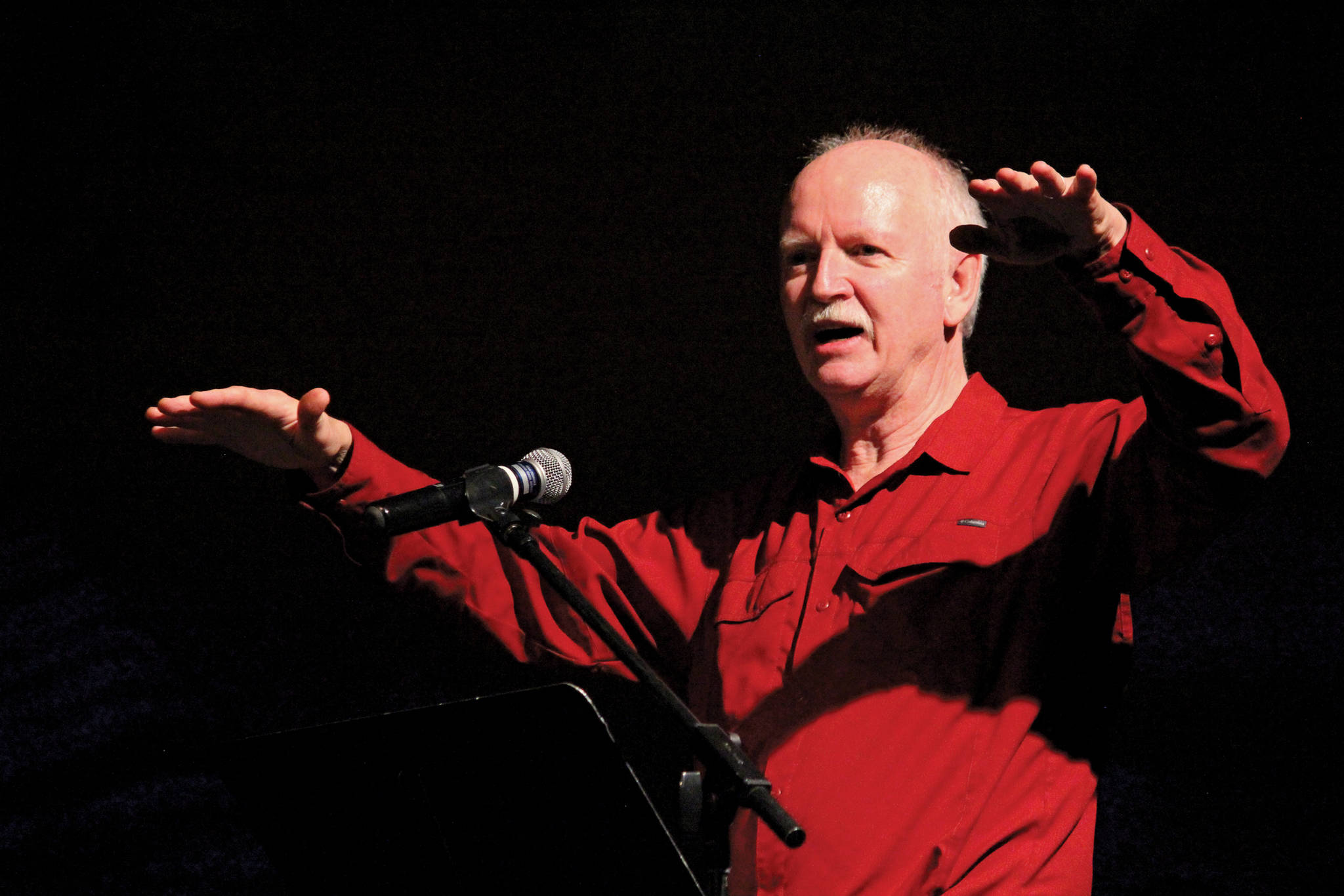 Robert Purcell tells a story about Gary Thomas, a Homer man who was killed last week in a water heater explosion, during a memorial for him Sunday, Jan. 19, 2020 at Homer Mariner Theatre at Homer High School in Homer, Alaska. (Photo by Megan Pacer/Homer News)
