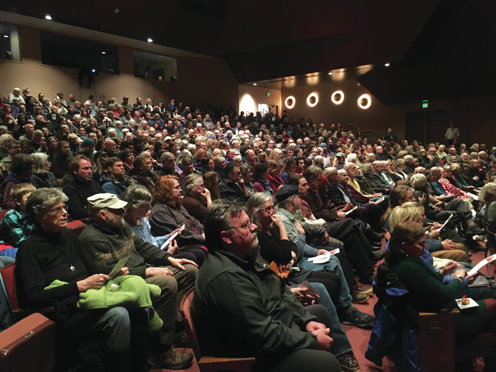 Community members fill the Homer Mariner Theatre as they wait for the memorial for Gary Thomas to begin Sunday, Jan. 19, 2020 at Homer High School in Homer, Alaska. Thomas, a local community volunteer and volunteer firefighter, was killed last week in a water heater explosion. (Photo by Megan Pacer/Homer News)