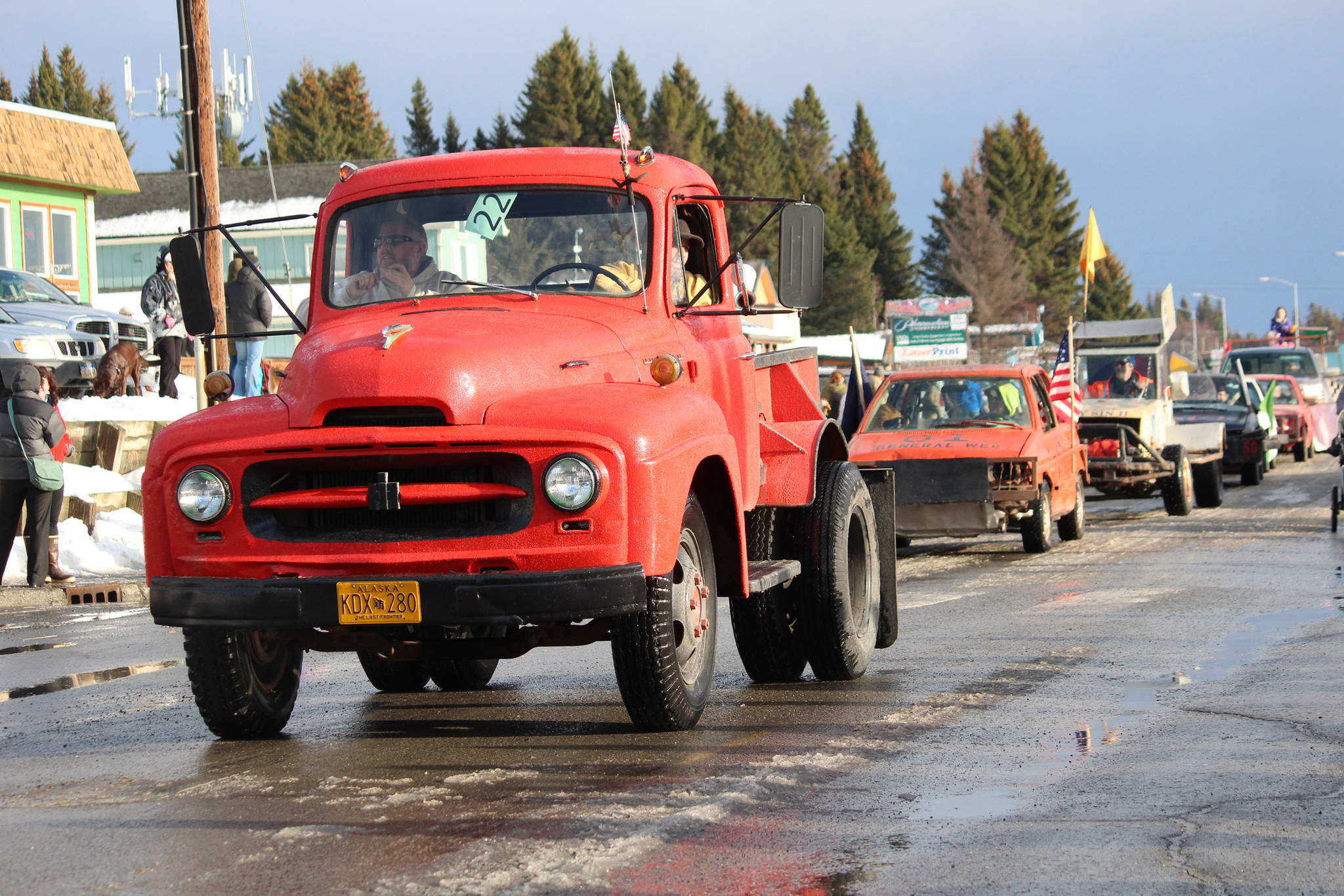 Classic and ice racing cars make their way down Pioneer Avenue during this year’s Homer Winter Carnival Parade on Saturday, Feb. 8, 2020 in Homer, Alaska. Ice races were held after the parade on Beluga Lake. (Photo by Megan Pacer/Homer News)