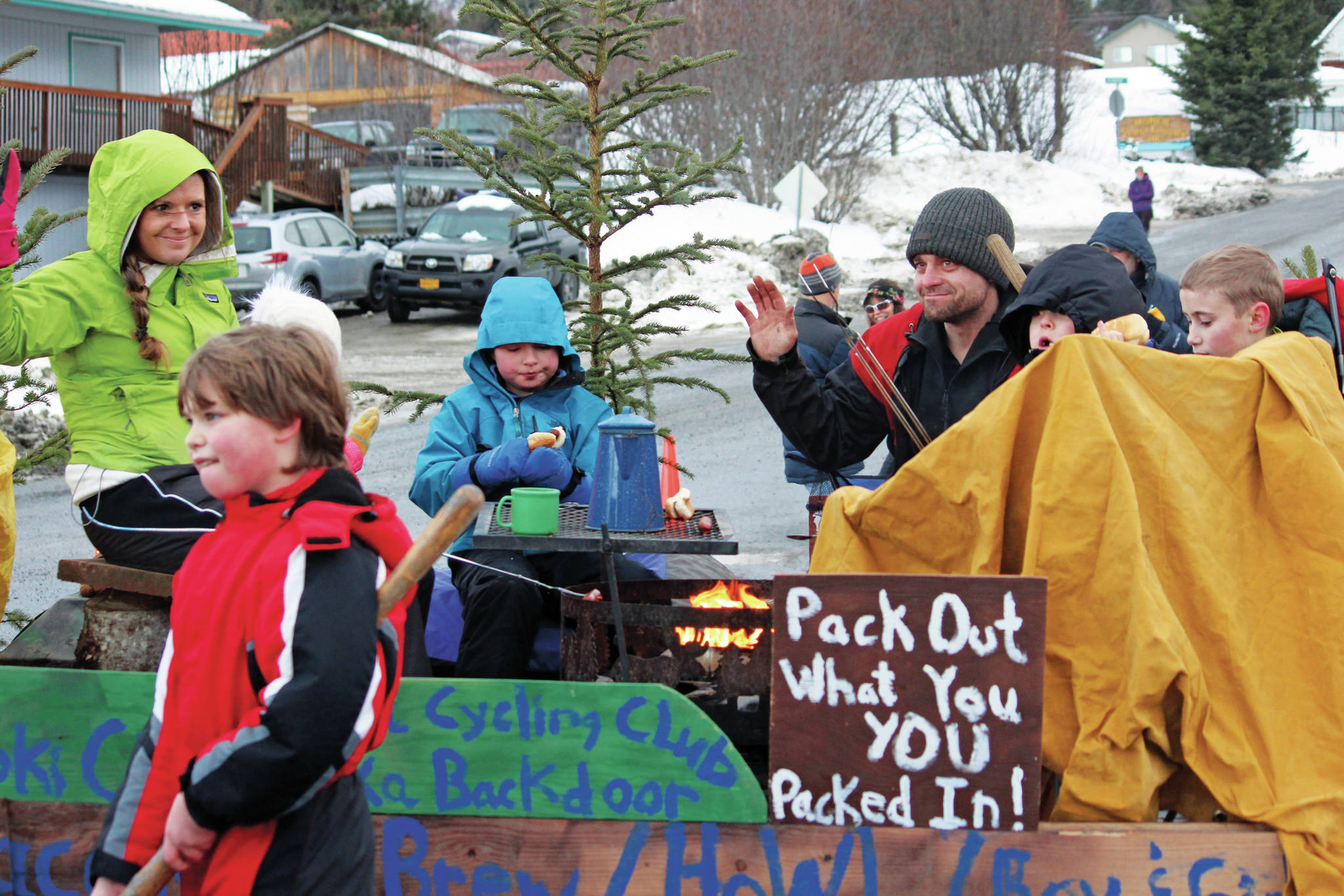 Parade participants with the Friends of Kachemak Bay State Park float move along Pioneer Avenue in this year’s Homer Winter Carnival Parade on Saturday, Feb. 8, 2020 in Homer, Alaska. (Photo by Megan Pacer/Homer News)
