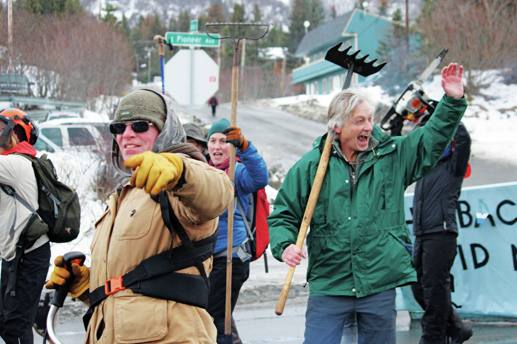 Parade participants representing trail crews who work on Kachemak Bay State Park trails march in this year’s Homer Winter Carnival parade on Saturday, Feb. 8, 2020 on Pioneer Avenue in Homer, Alaska. (Photo by Megan Pacer/Homer News)