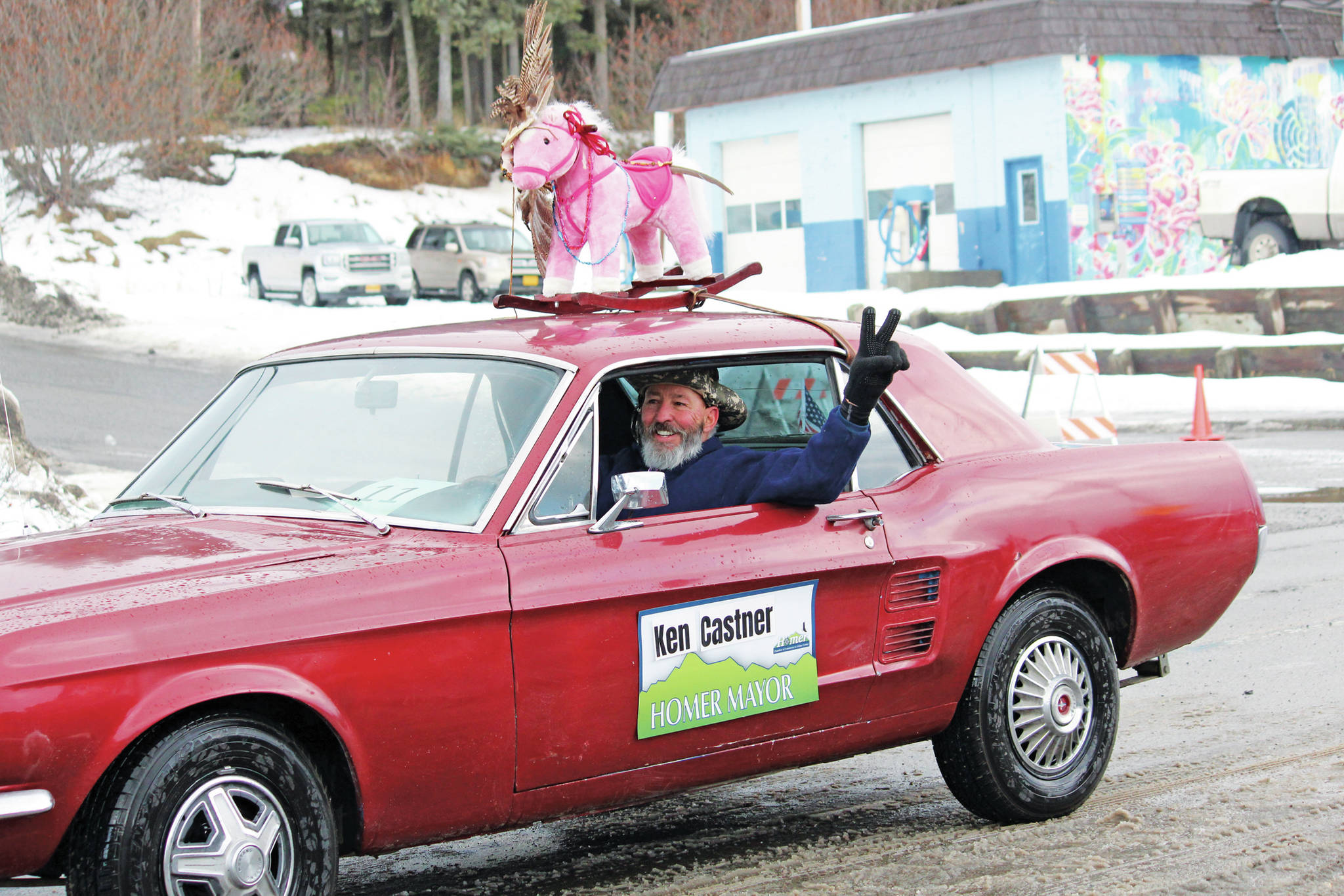 Former Mayor Bryan Zak drives the car for the float representing Mayor Ken Castner’s office during this year’s Homer Winter Carnival Parade on Saturday, Feb. 8, 2020 on Pioneer Avenue in Homer, Alaska. (Photo by Megan Pacer/Homer News)