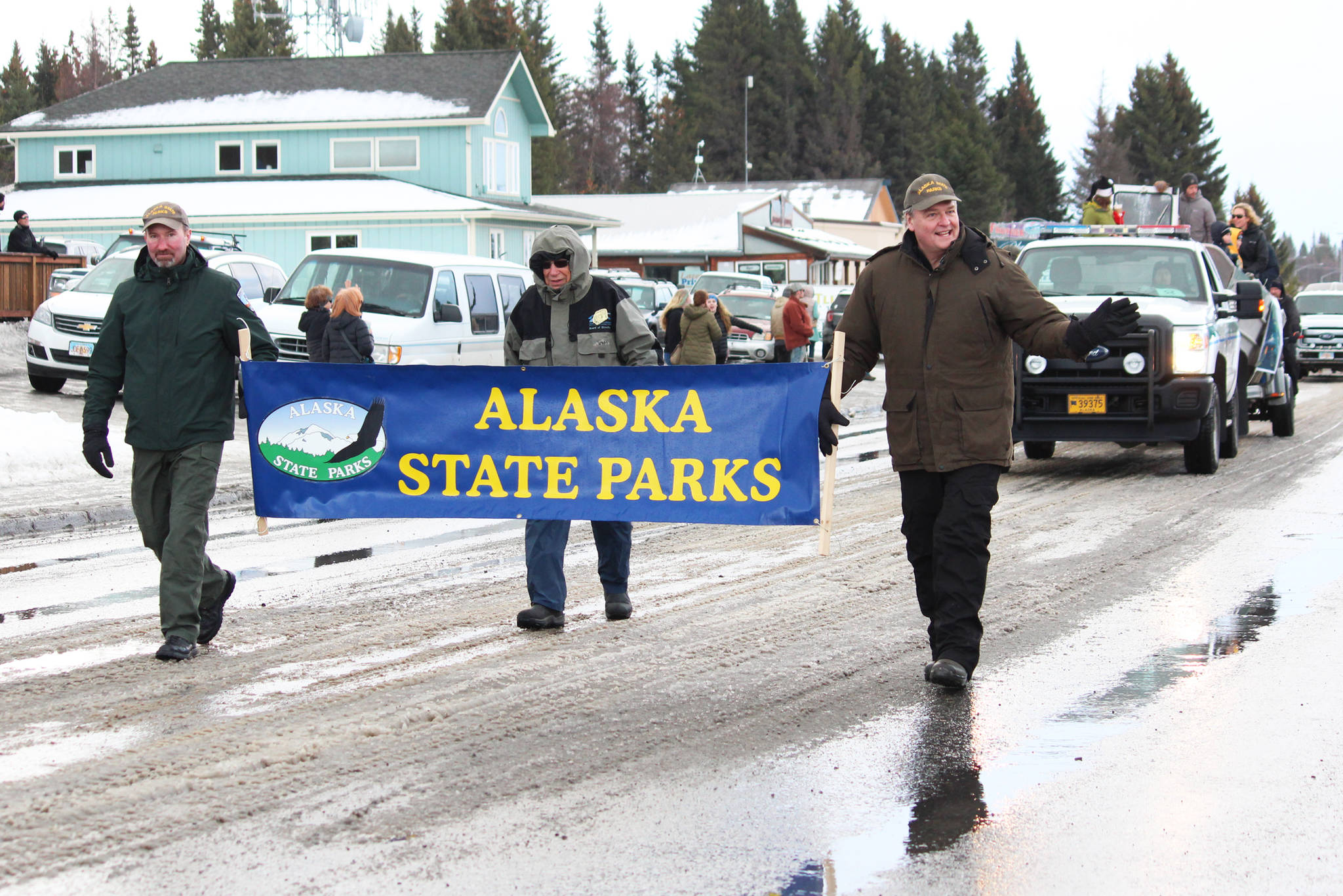 Representatives from the Alaska State Parks march in this year’s Homer Winter Carnival Parade on Saturday, Jan. 8, 2020 on Pioneer Avenue in Homer, Alaska. This year’s theme was a tribute to the 50th anniversary of Kachemak Bay State Park. (Photo by Megan Pacer/Homer News)