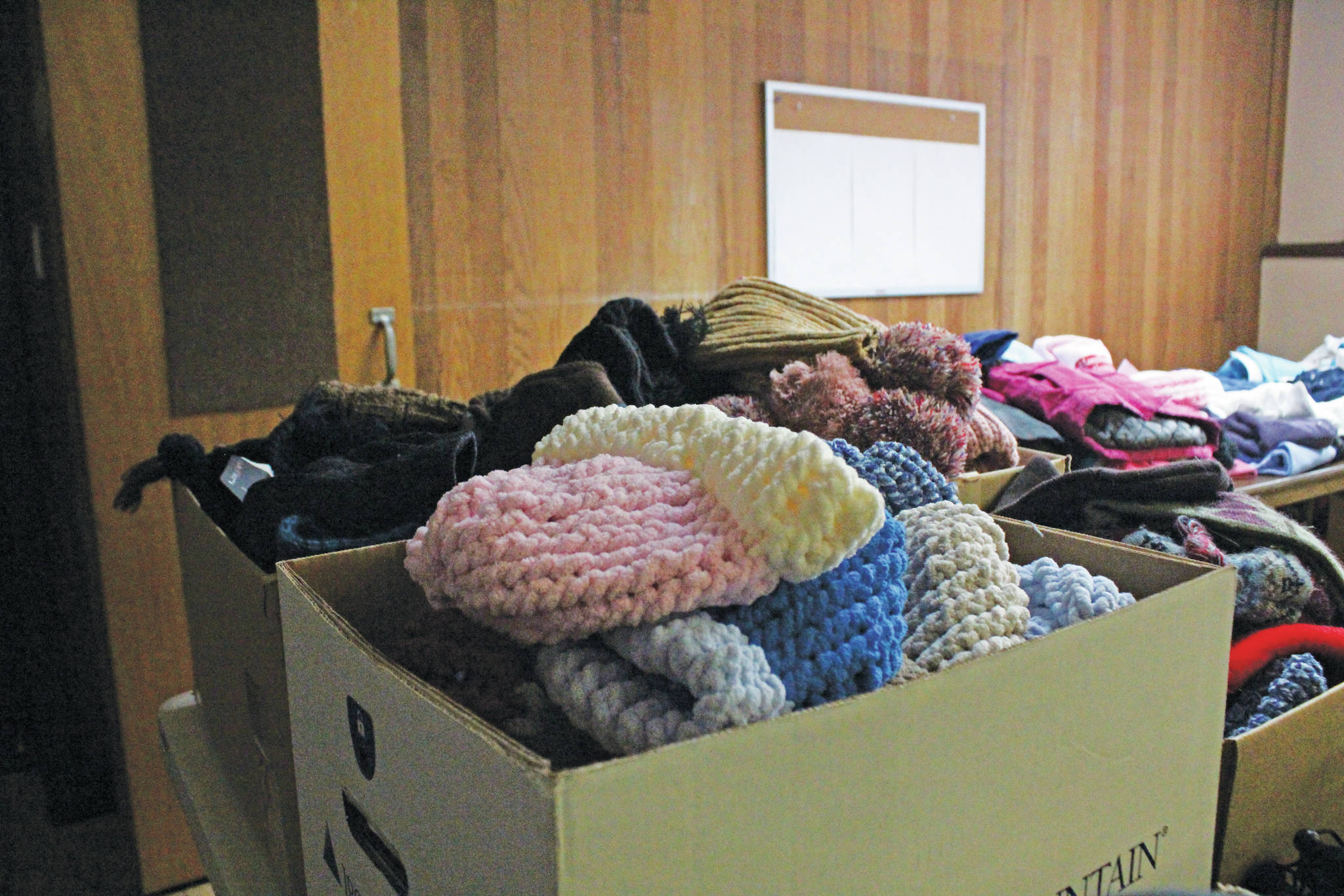 Winter clothing waits to be taken by those experiencing homelessness during Homer’s first time participating in Project Homeless Connect on Jan. 29, 2020 at Homer United Methodist Church in Homer, Alaska. (Photo by Megan Pacer/Homer News)