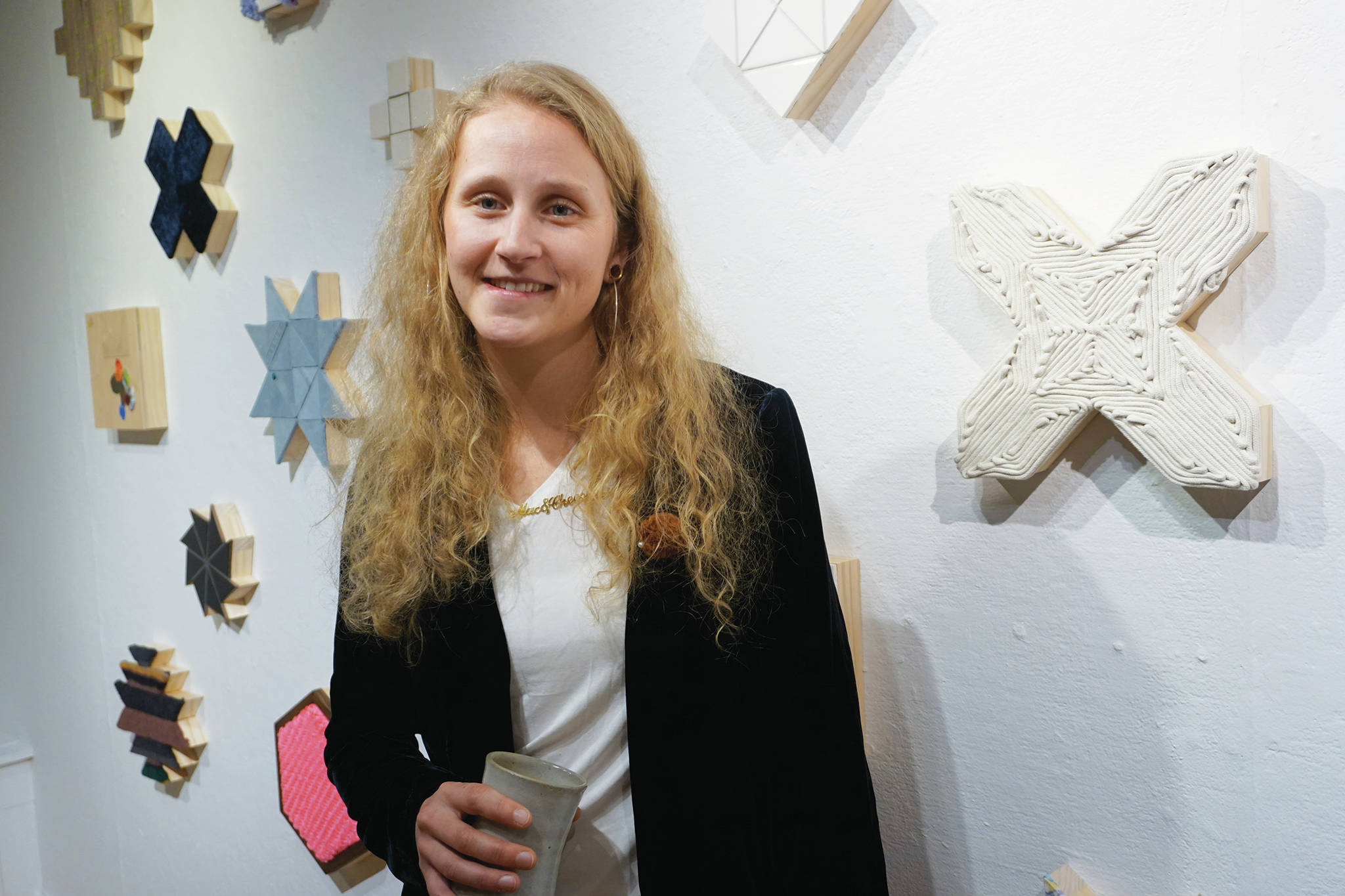 Tamara Wilson poses for a photo at at the First Friday opening on Feb. 15, 2020, of her show, “Macaroni and Cheese,” at Bunnell Street Arts Center in Homer, Alaska. (Photo by Michael Armstrong/Homer News)