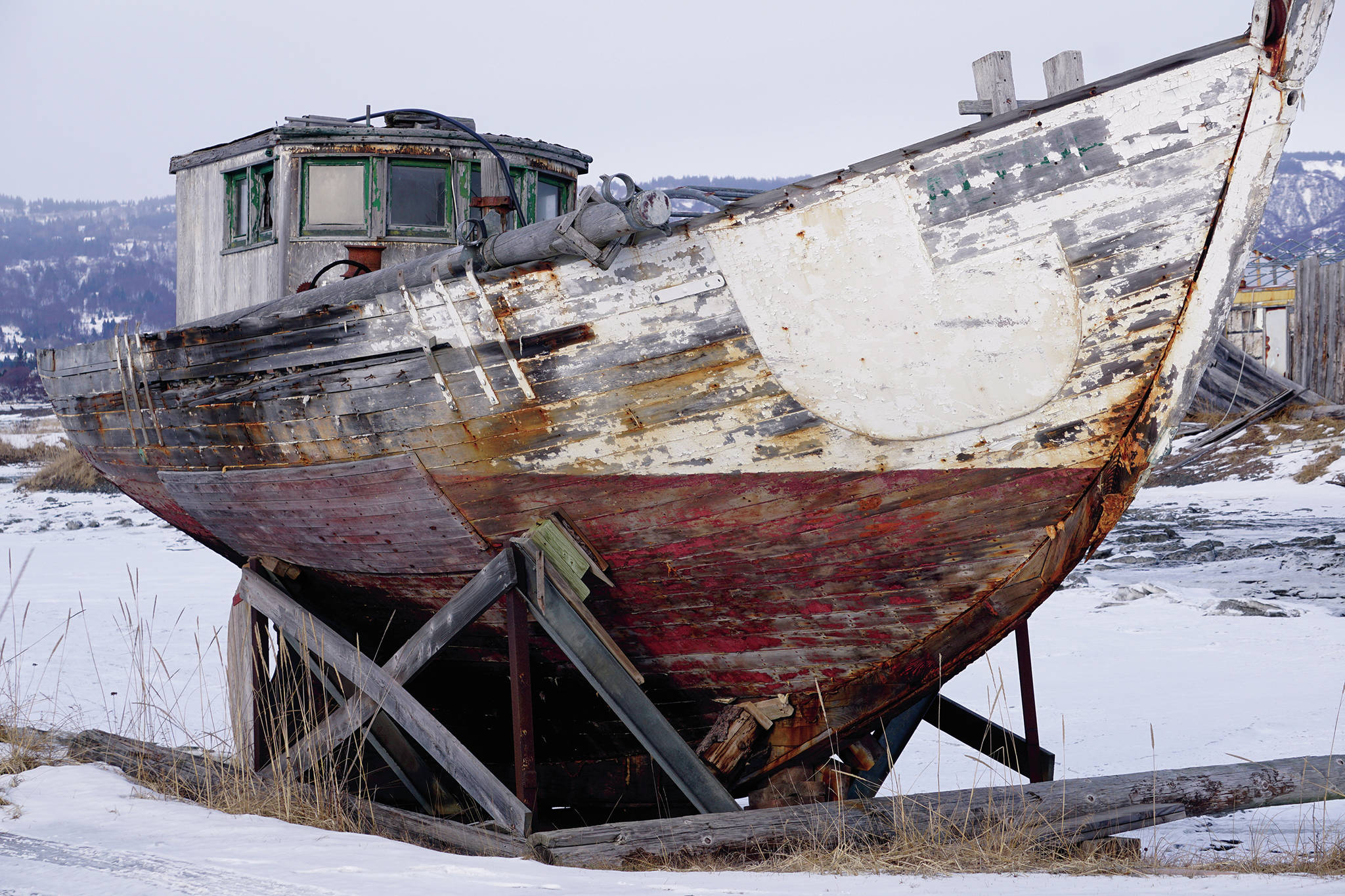 The Altair braves the elements on the Homer Spit on Feb. 14, 2020, in Homer, Alaska. The classic wooden boat is frequently photographed or painted. (Photo by Michael Armstrong/Homer News)