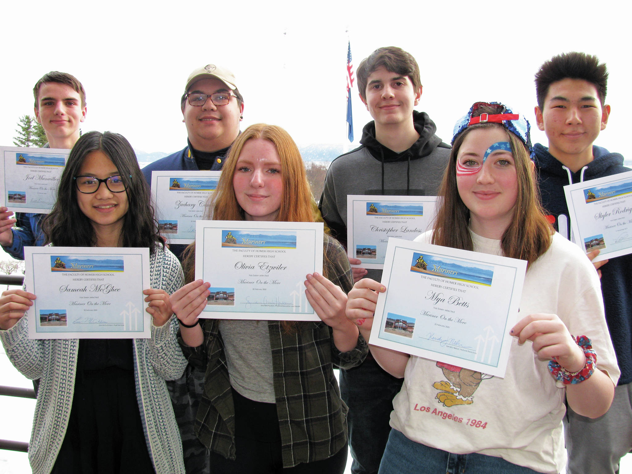 From left to right: Homer High School students Joel Manwiller, Sameah McGhee, Zach Condon, Olivia Etzwiler, Chris Landess, Mya Betts and Skyler Rodirguez hold their Mariners on the Move awards in this undated photo at Homer High School in Homer, Alaska. Not pictured: Lilly Smith. (Photo courtesy Paul Story)