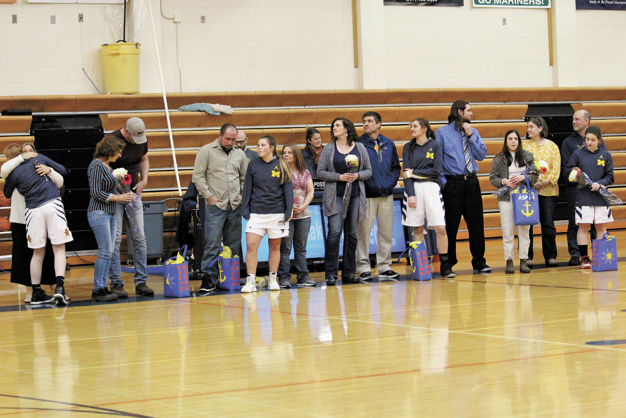 Senior players on the Homer girls basketball team are honored in a senior night ceremony after a Friday, Feb. 28, 2020 game against Nikiski in the Alice Witte Gymnasium in Homer, Alaska. (Photo by Megan Pacer/Homer News)