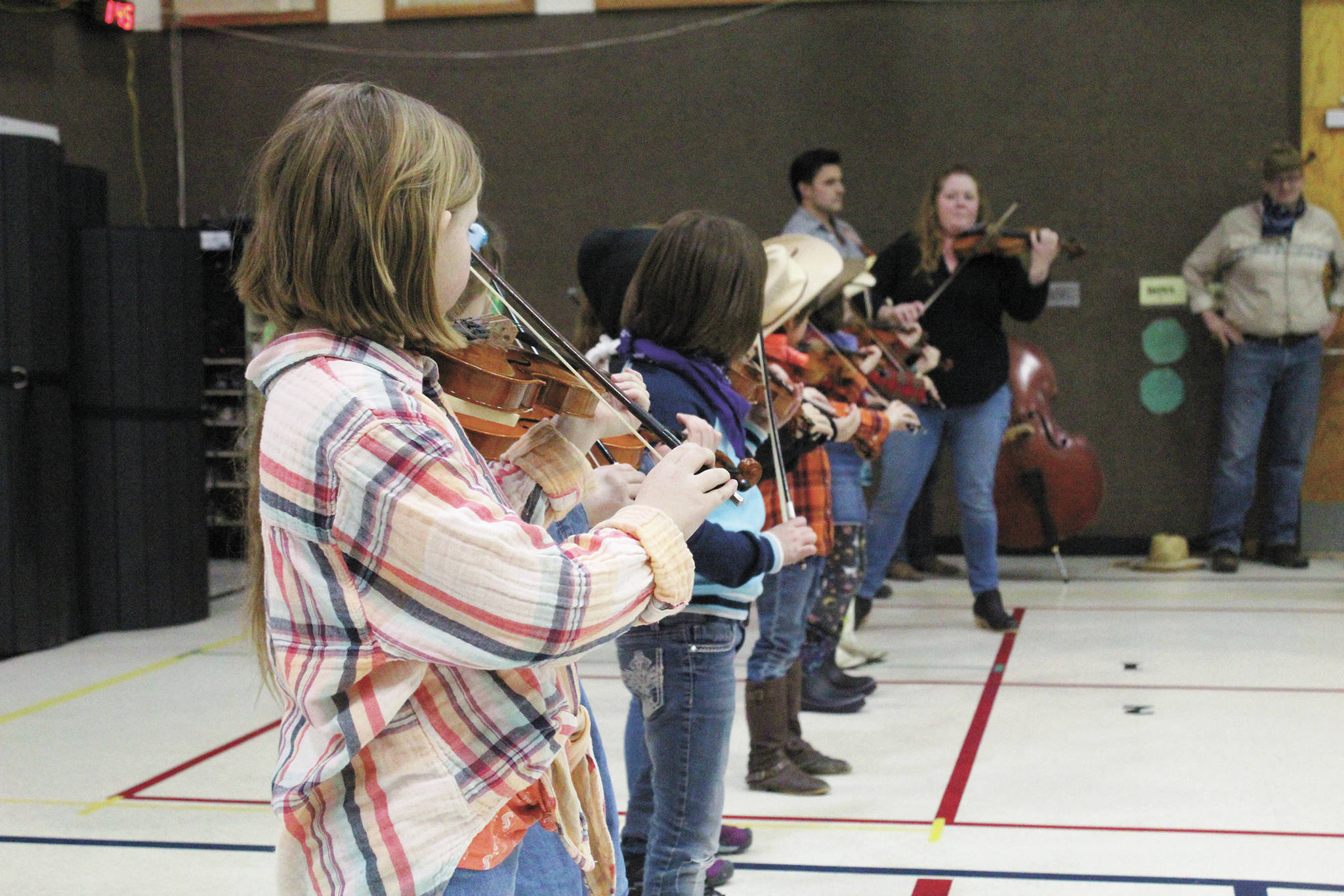 Members of the Paul Banks Preludes, under the direction of Katy Klann perform at a Thursday, March 5, 2020 assembly to celebrate the end of the school’s annual read-a-thon at Paul Banks Elementary School in Homer, Alaska. (Photo by Megan Pacer/Homer News)