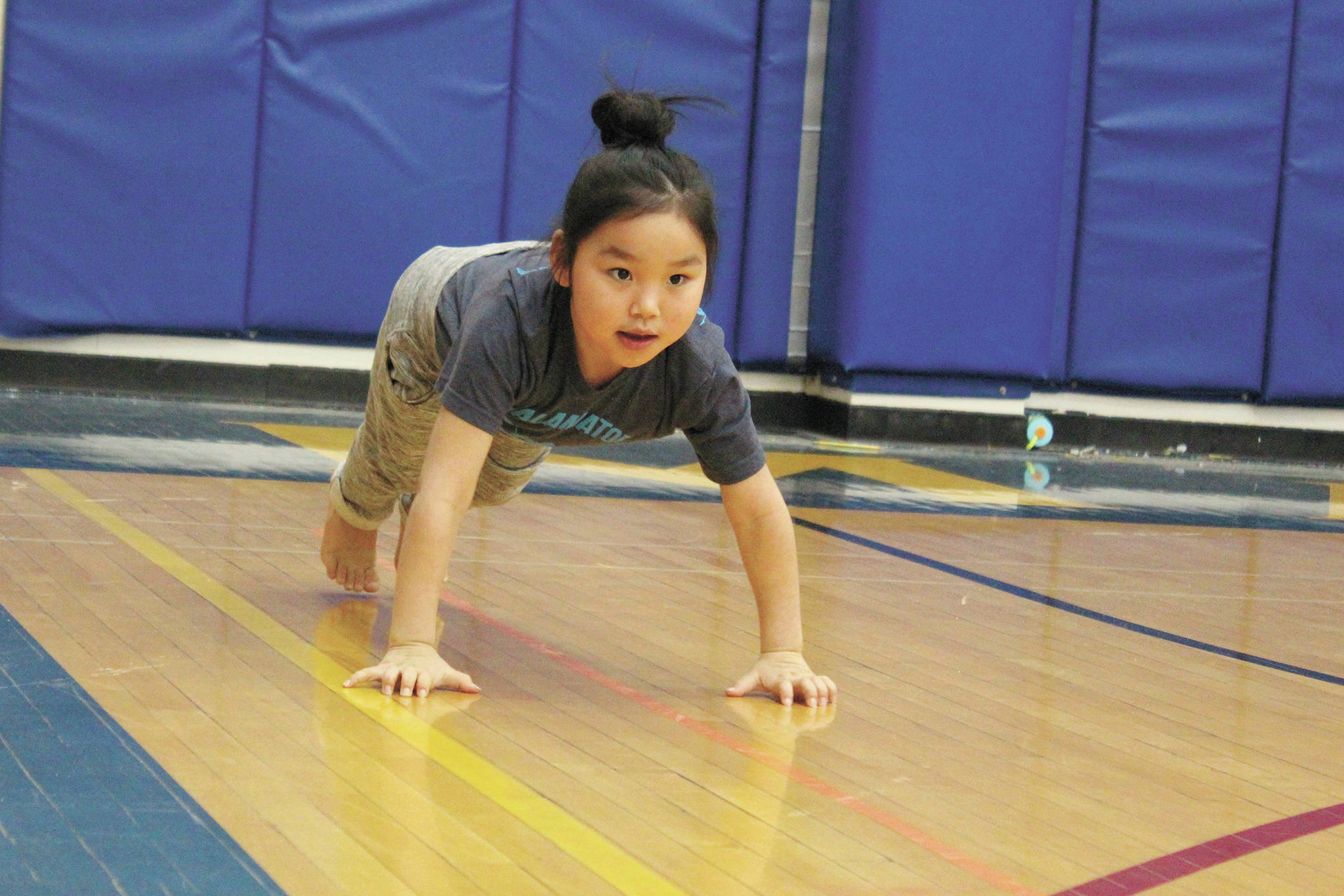 Kyree Sagoonick competes in the seal jop for junior girls Saturday, March 7, 2020 during the Kachemak Bay Traditional Games at Homer High School in Homer, Alaska. (Photo by Megan Pacer/Homer News)