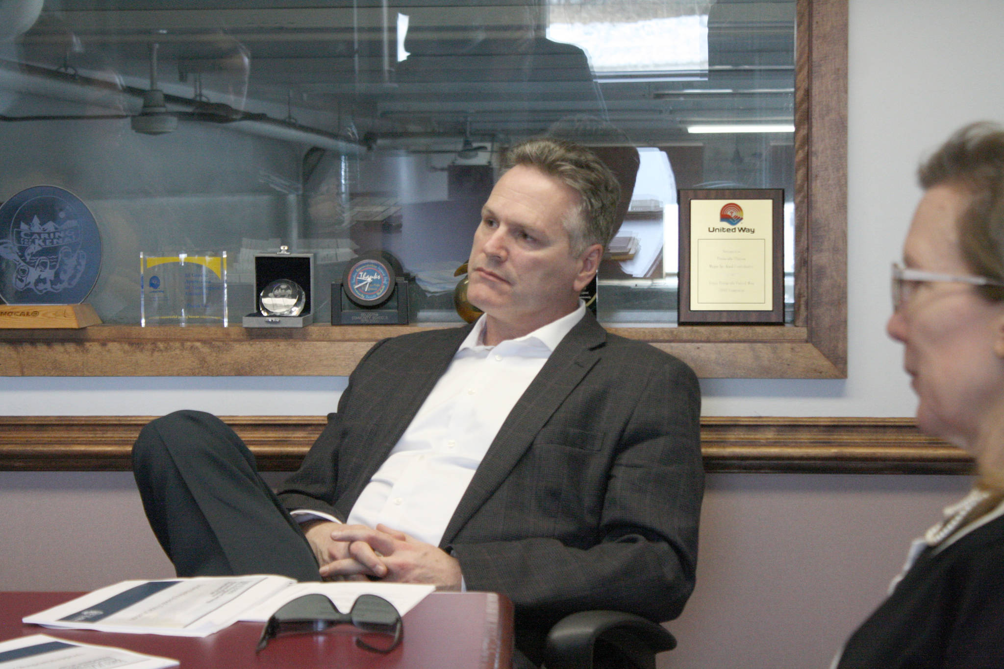 Gov. Mike Dunleavy, center, speaks about education with Clarion reporters Brian Mazurek and Victoria Petersen (not pictured) on Monday, March 25, 2019, in Kenai, Alaska. The governor answered questions on a wide range of topics, including public safety, education, industry and his proposed budget. (Photo by Erin Thompson/Peninsula Clarion)