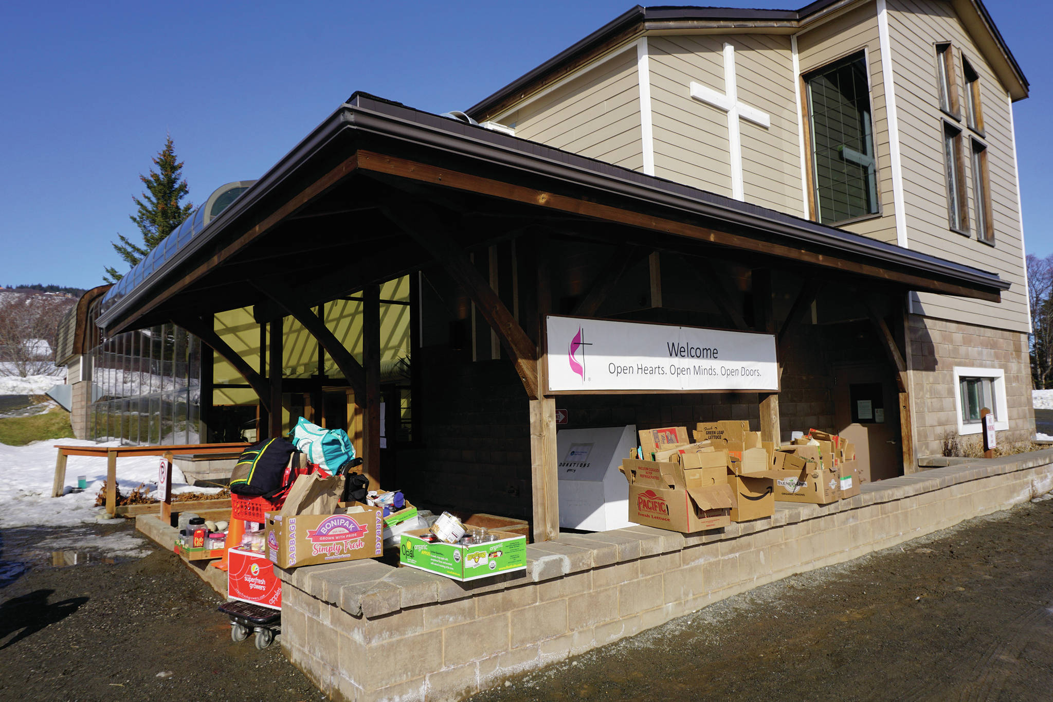 Packing boxes are left over after distribution day at the Homer Community Food Pantry at Homer United Methodist Church on Monday, March 16, 2020, in Homer, Alaska. The food pantry will distribute food, but with modified delivery to minimize social contact. (Photo by Michael Armstrong/Homer Newws)