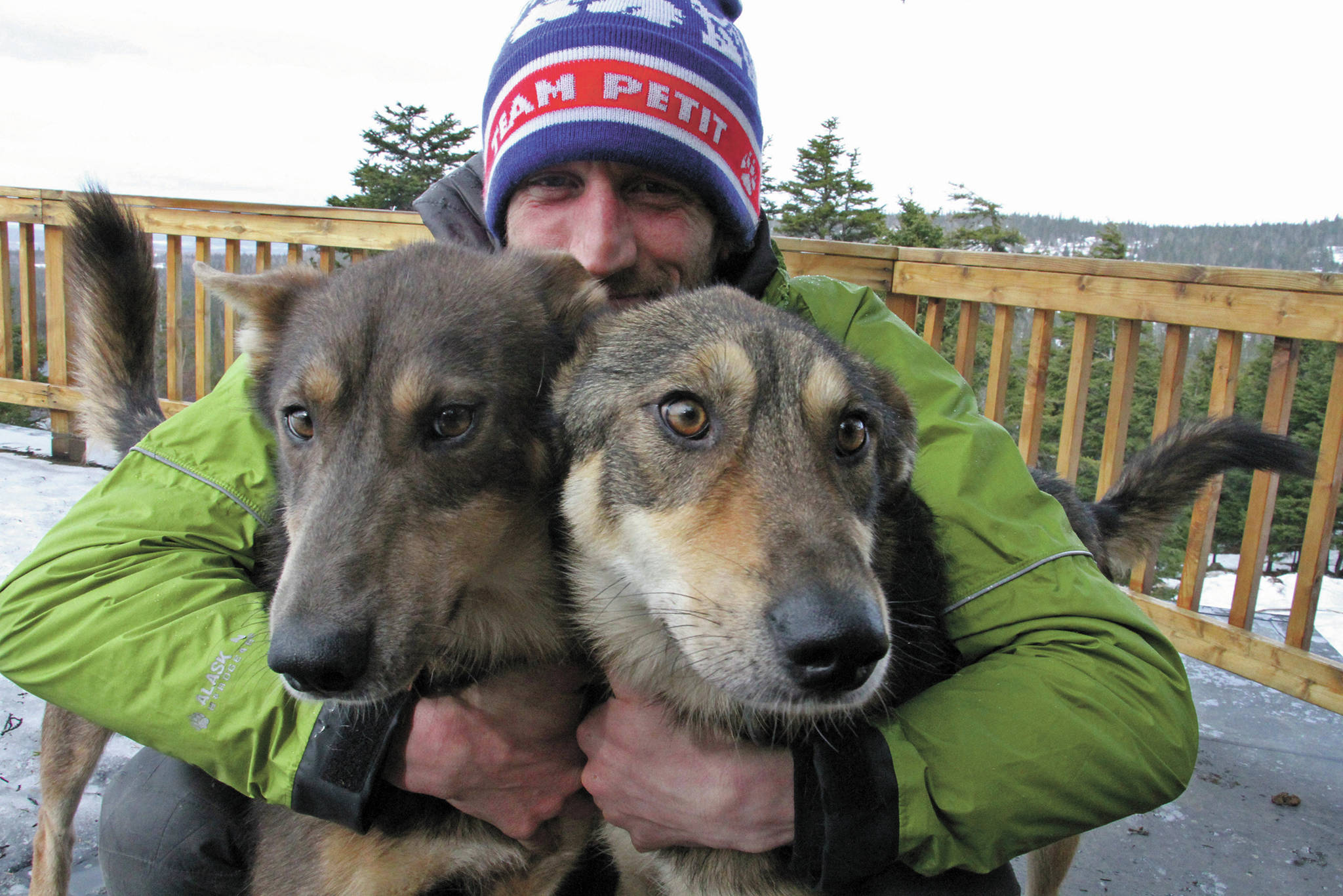 AP file Photo/Mark Thiessen                                 In this March 20, 2019, file photo, Iditarod musher Nicolas Petit, of France, poses with two of his dogs in Anchorage. Nearly a third of the 57 mushers in this year’s Iditarod Trail Sled Dog Race have quit the race before finishing, including Petit, who activated an alert button seeking rescue last Thursday morning, March 19, because of weather conditions.