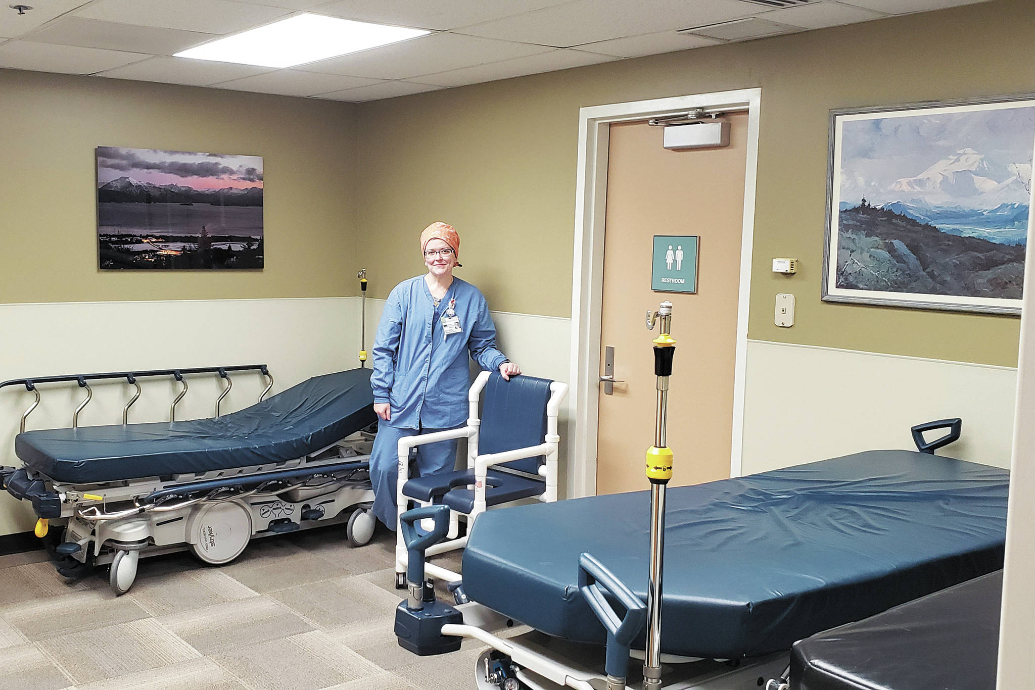 Anna Worster, RN, the Director of Surgical Services at South Peninsula Hospital in Homer, Alaska, stands in the surgery waiting room, which has been converted into a three-person inpatient room. The surgery department will be the area for patients hospitalized with other medical needs during the COVID-19 pandemic. (Photo courtesy South Peninsula Hospital)