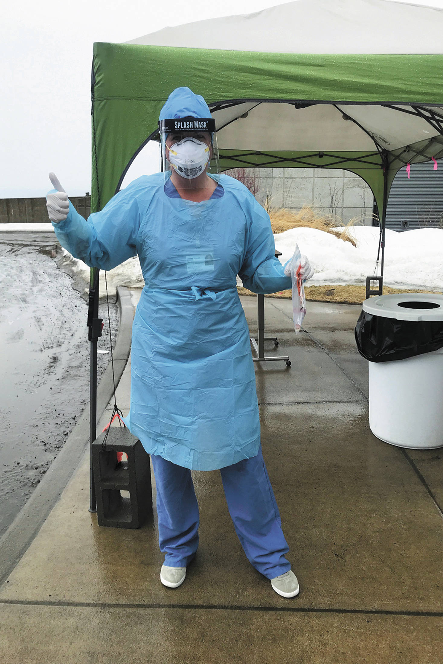 Erica Douglas, RN, holds sterile respiratory swab applicators, used for testing COVID-19, at the outdoor testing site near South Peninsula Hospital’s main entrance in Homer, Alaska. (Photo courtesy Derotha Ferraro)