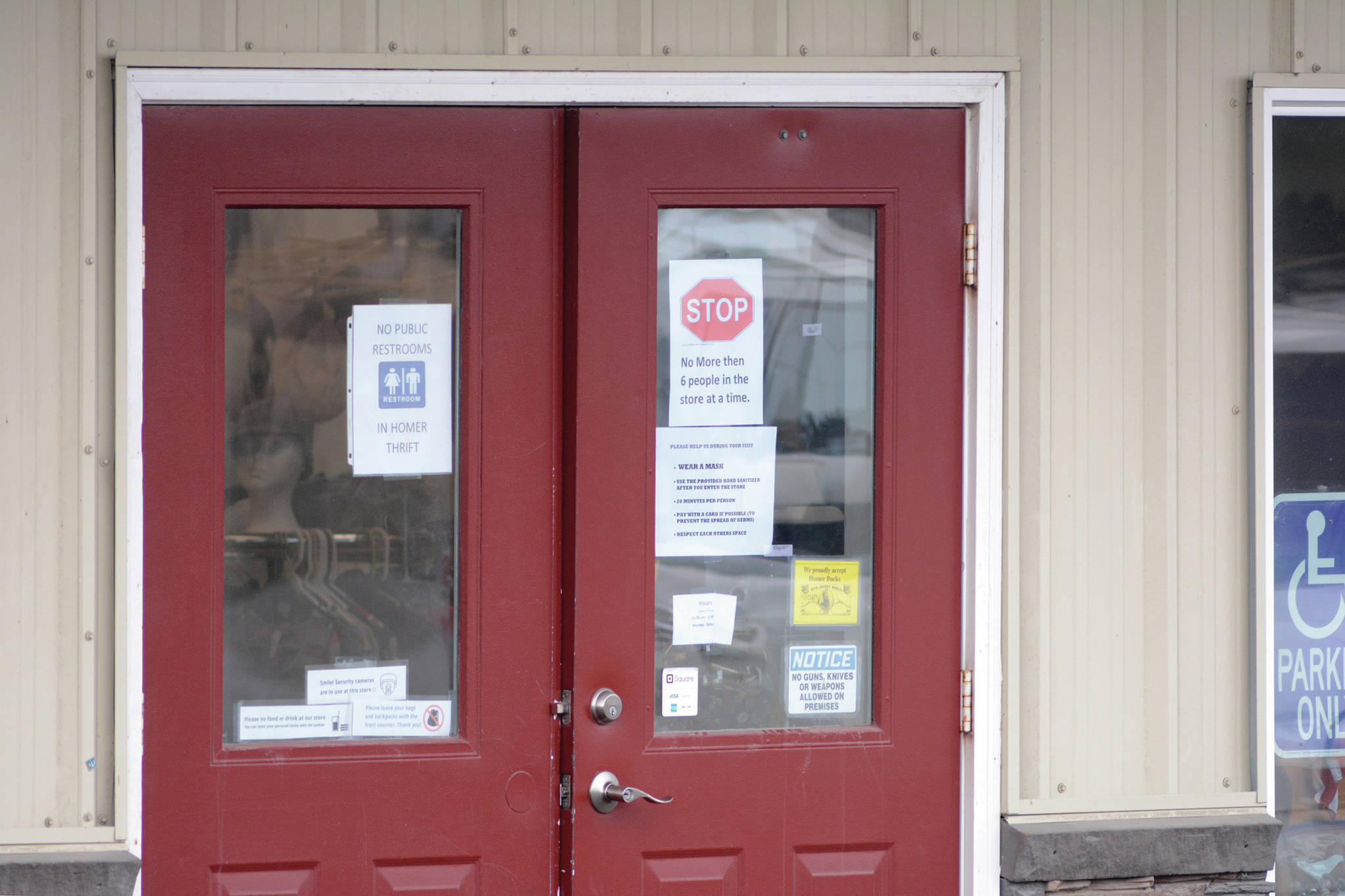 Signs at Homer Thrift on Ocean Drive announce new guidelines for retail stores to allow in-store customers on Friday, April 24, 2020, in Homer, Alaska. (Photo by Michael Armstrong/Homer News)