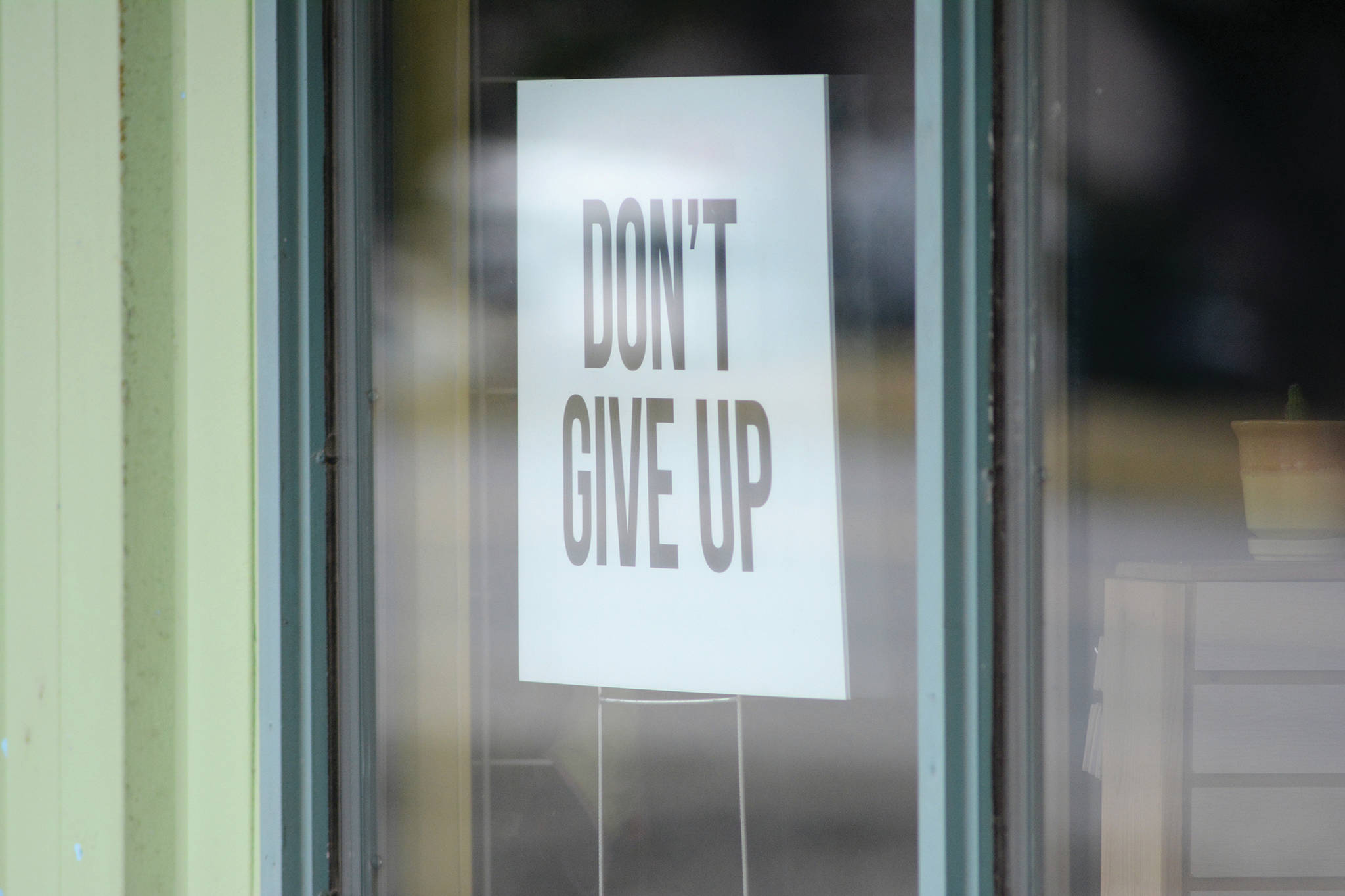 A sign in the window of Sustainable Wares on Ocean Drive offers a message of hope on Friday, April 24, 2020, in Homer, Alaska. Although the store could open to customers under new state health mandates that took effect on Friday, the story has chosen to continue offering online sales. (Photo by Michael Armstrong/Homer News)