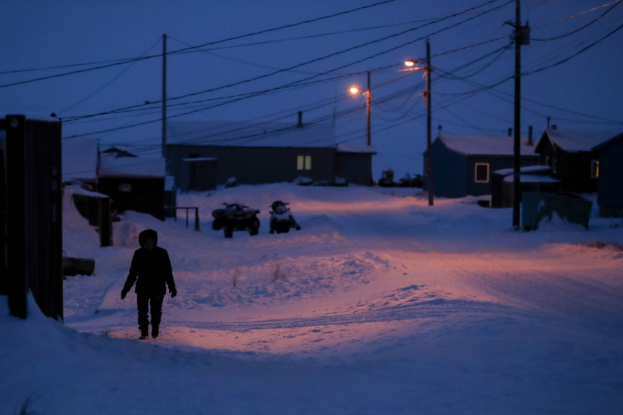 AP Photo | Gregory Bull, File                                 A woman walks before dawn in Toksook Bay, Alaska, a mostly Yup’ik village on the edge of the Bering Sea. A judge has ruled in favor of tribal nations in their bid to keep Alaska Native corporations from getting a share of $8 billion in coronavirus relief funding — at least for now. In a decision issued late Monday, April 27, U.S. District Judge Amit Mehta in Washington, D.C., said the U.S. Treasury Department could begin disbursing funding to 574 federally recognized tribes to respond to the coronavirus but not to the corporations.