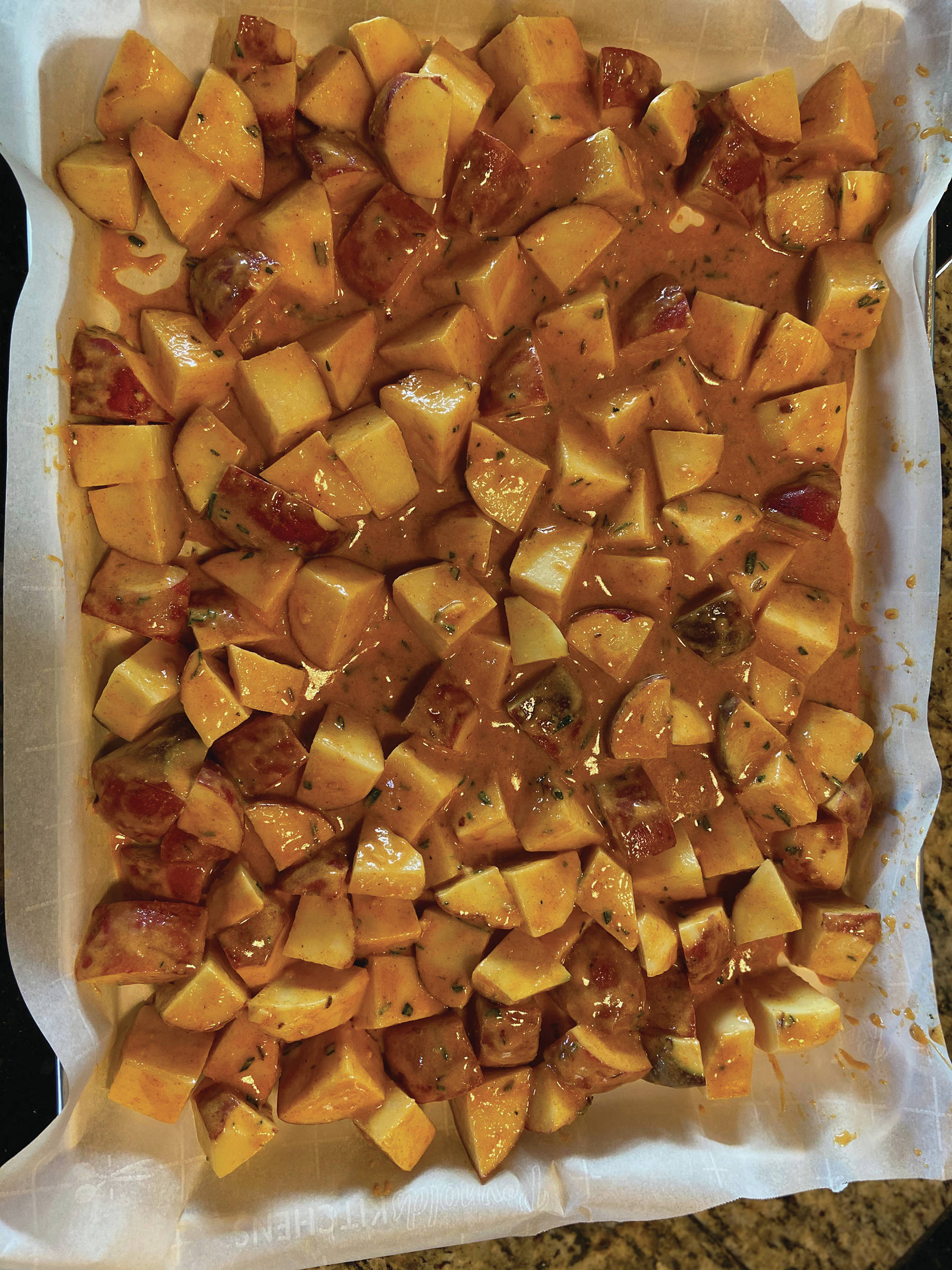 Teri Robl’s spicy potatoes are ready to go into the oven on April 25, 2020, in her Homer, Alaska kitchen. (Photo by Teri Robl)