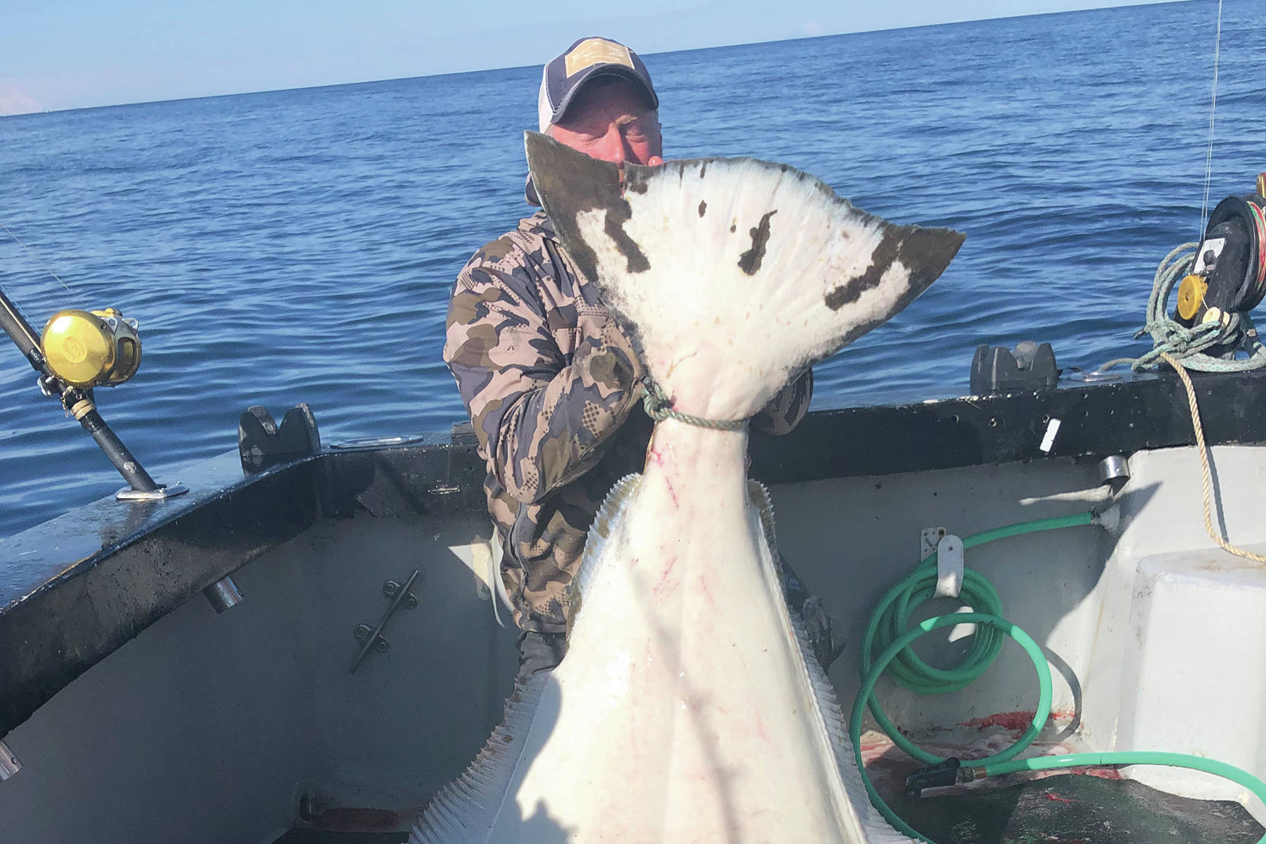 Chris Giegerich holds a monster halibut he caught on the F/V Huntress with Capt. Josh Brooks on May 3, 2020, while fishing in lower Cook Inlet with his family. (Photo courtesy of Joleen Brooks, F/V Huntress)