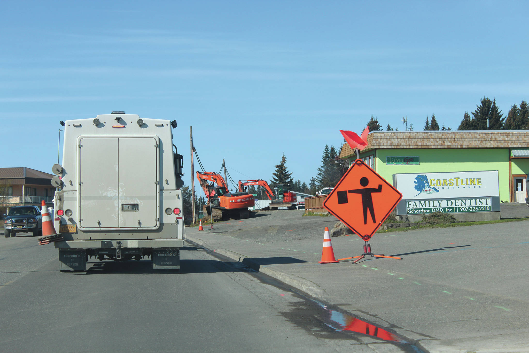 Vehicles make their way along Pioneer Avenue amid construction work Wednesday, May 13, 2020 in Homer, Alaska. (Photo by Megan Pacer/Homer News)