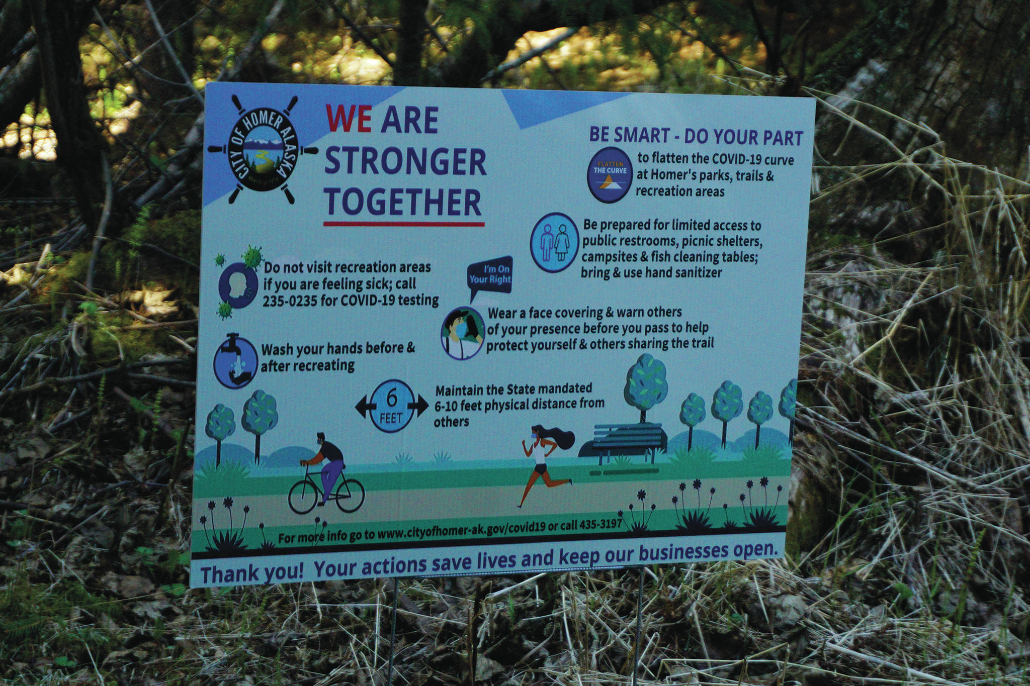 A sign at the Pratt Museum’s nature trail on May 15, 2020, in Homer, Alaska, is part of the City of Homer’s campaign to increase awareness of precautions to take during the COVID-19 pandemic. (Photo by Michael Armstrong/Homer News)