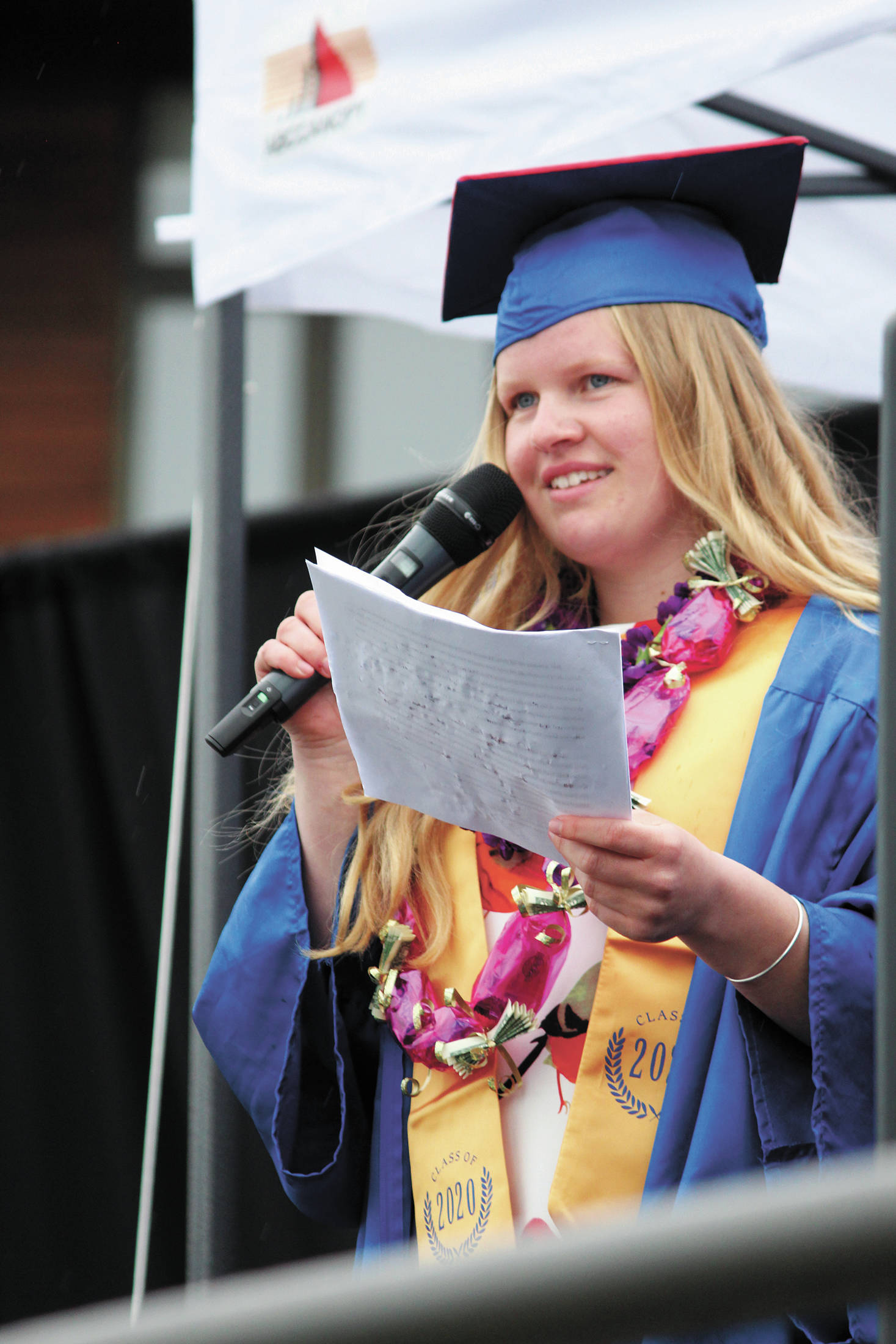 Salutatorian Daisy Kettle speaks to her fellow graduates during Homer High School’s commencement ceremony, held outside the school Monday, May 18, 2020 in Homer, Alaska. (Photo by Megan Pacer/Homer News)