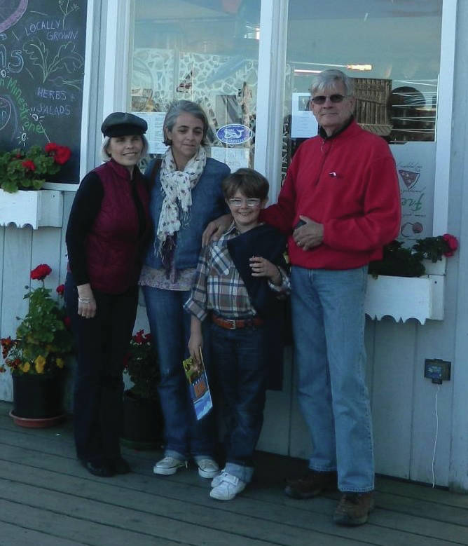 Sophie Samuzeau poses with with her son and Homer host parents Flo Larson, far left, and Peter Larson, far right, in a 2012 photo. (Photo courtesy Flo Larson)