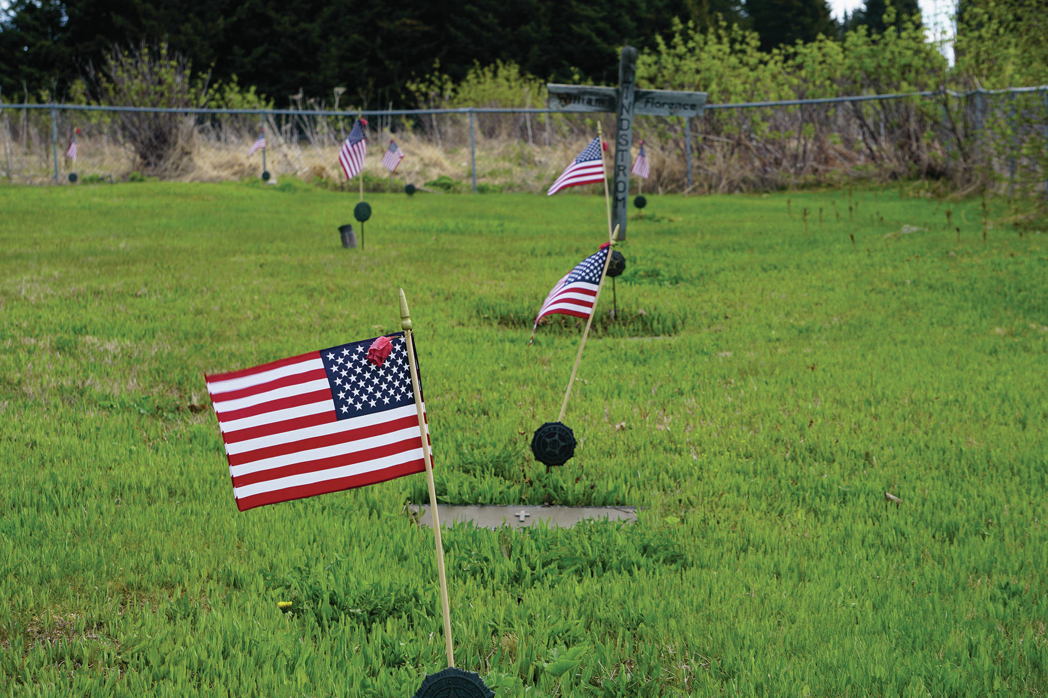 American flags decorate the graves of veterans buried in the Hickerson Memorial Cemetery on Diamond Ridge near Homer, Alaska. Memorial Day observances were held at the cemetery on Monday, May 25, 2020. The war dead include men and women who served in every U.S. war since World War I. (Photo by Michael Armstrong/Homer News)