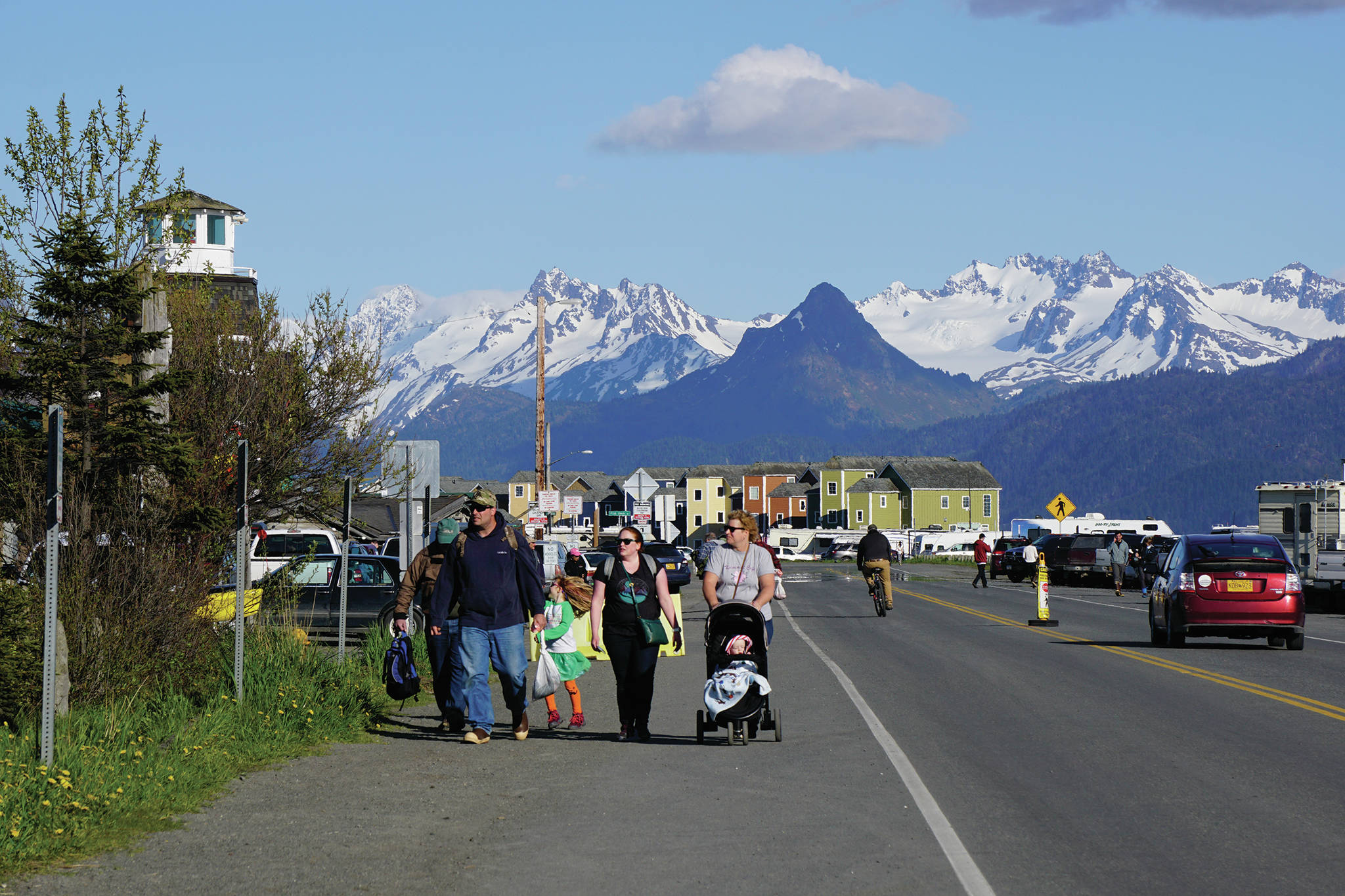 Visitors walk along the Homer Spit on Sunday, May 24, 2020, during the Memorial Day weekend in Homer, Alaska. (Photo by Michael Armstrong/Homer News)