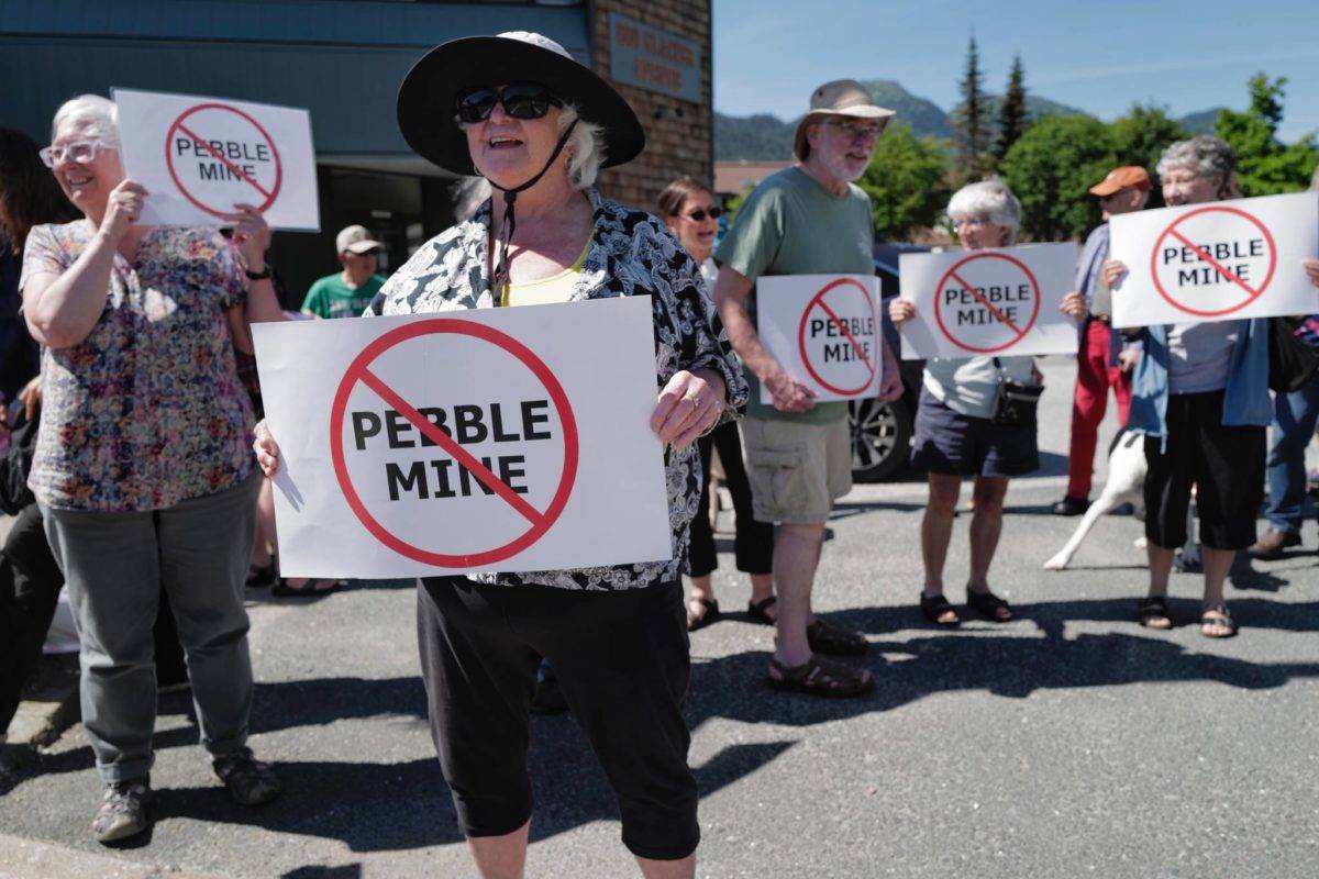 Judy Cavanaugh stands with others at a rally against the Pebble Mine in front of Sen. Lisa Murkowski���s Juneau office on Tuesday, June 25, 2019. (Michael Penn | Juneau Empire File)