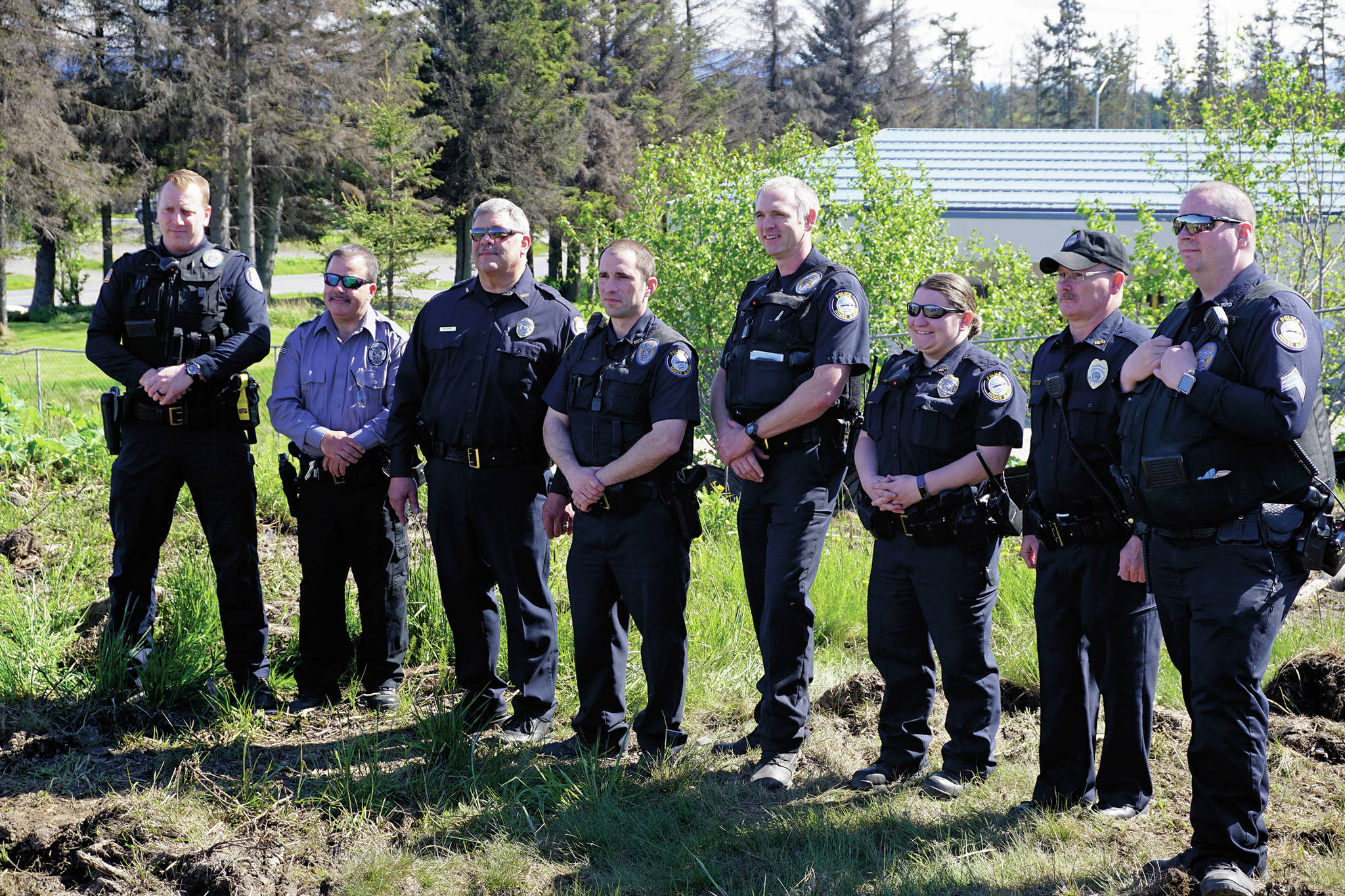 Homer Police Chief Mark Robl, third from left, stands with some of the Homer Police Department officers and jail officers at groundbreaking ceremonies on May 24, 2019, for the new police station in Homer, Alaska. (Photo by Michael Armstrong/Homer News)