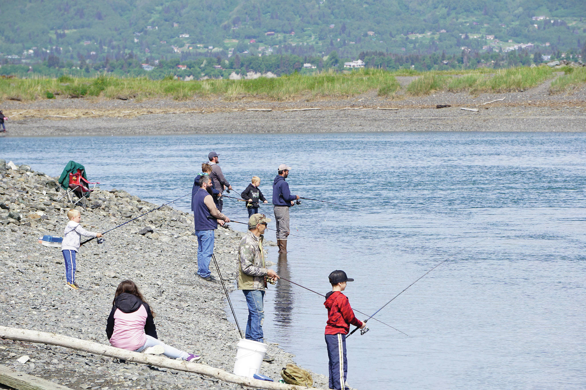 Fishermen young and old try their luck at the Nick Dudiak Fishing Lagoon on June 4, 2020, on the Homer Spit in Homer, Alaska. (Photo by Michael Armstrong/Homer News)