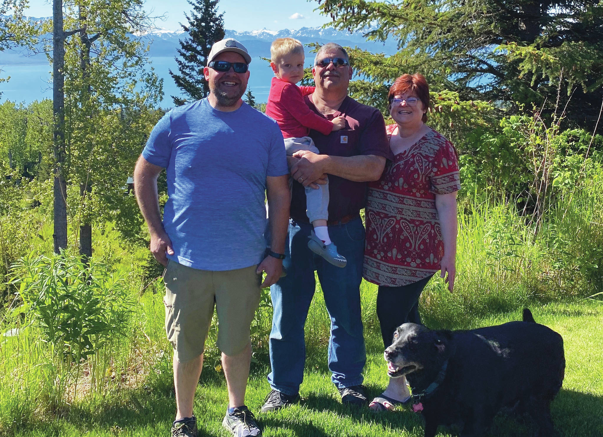 The Robl men pose with Teri Robl for a photo on Sunday, June 14, 2020, in Homer, Alaska. From left to right are Dave Robl, Kase Robl, “Papa” Mark Robl and “Nani” Teri Robl. (Photo by Matt Eberhardt)