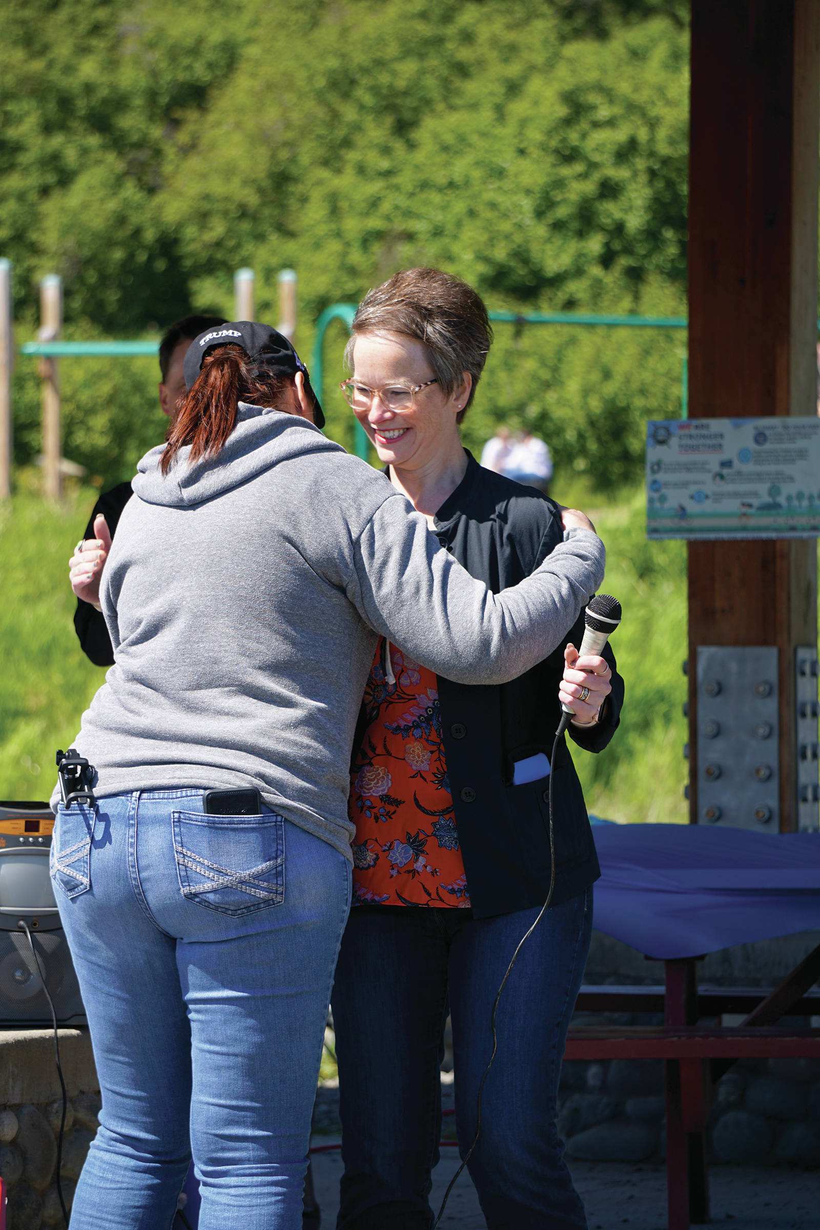 Cassie Lawver, left, hugs Rep. Sarah Vance, R-Homer, after Lawver introduced her at a kickoff for Vance’s re-election campaign on Sunday, June 14, 2020, at Karen Hornaday Park in Homer, Alaska. (Photo by Michael Armstrong/Homer News)