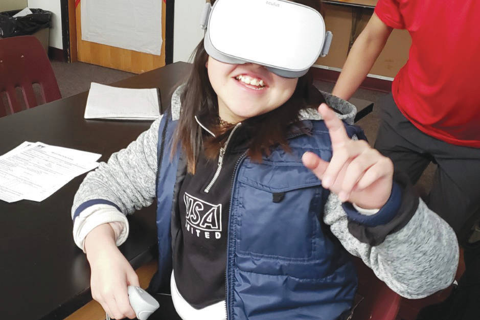 Student Julia Merculief in St. Paul, Alaska, explores refuge islands using virtual reality headsets. (Photo by Kendra Bush/USFWS)