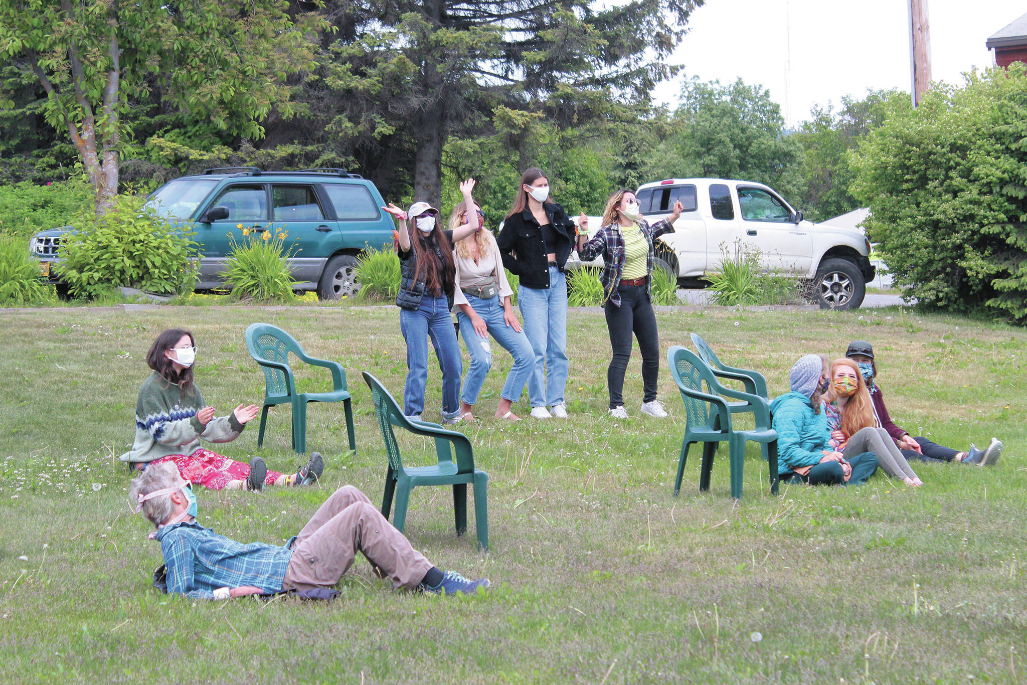 Some people sit and listen while others dance to faith music during the first ever Juneteenth celebration in Homer, held Friday, June 19, 2020 at WKFL Park in Homer, Alaska. (Photo by Megan Pacer/Homer News)