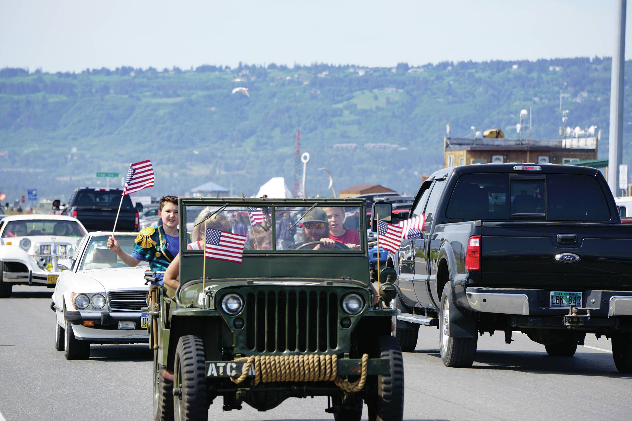 A historic military Jeep is part of a group of classic vehicles that did a cruise around Homer on Saturday, July 4, 2020 through town and to the end of the Homer Spit in Homer, Alaska. (Photo by Michael Armstrong/Homer News)